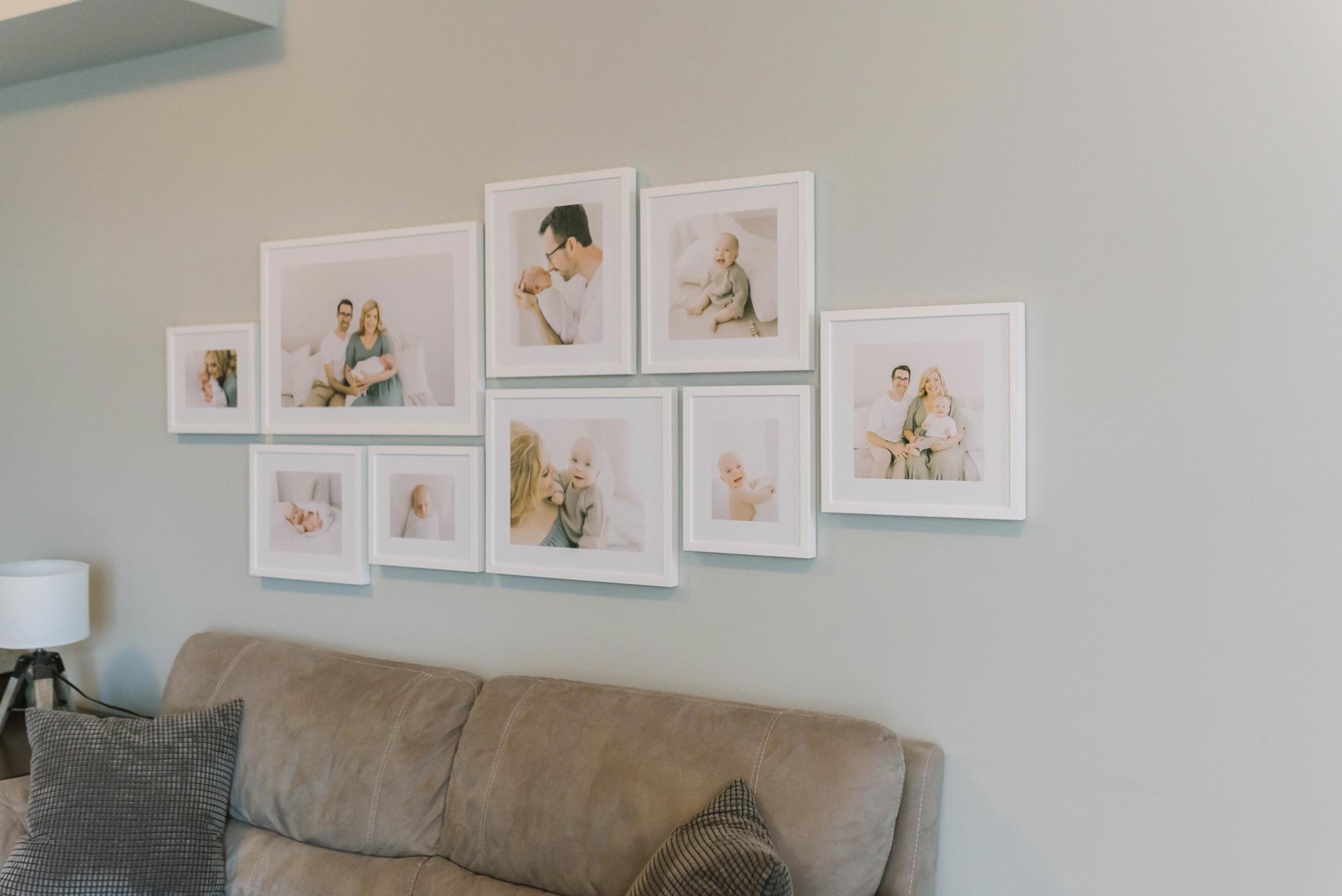 Framed family photography artwork gallery wall installed in Hamilton client's home