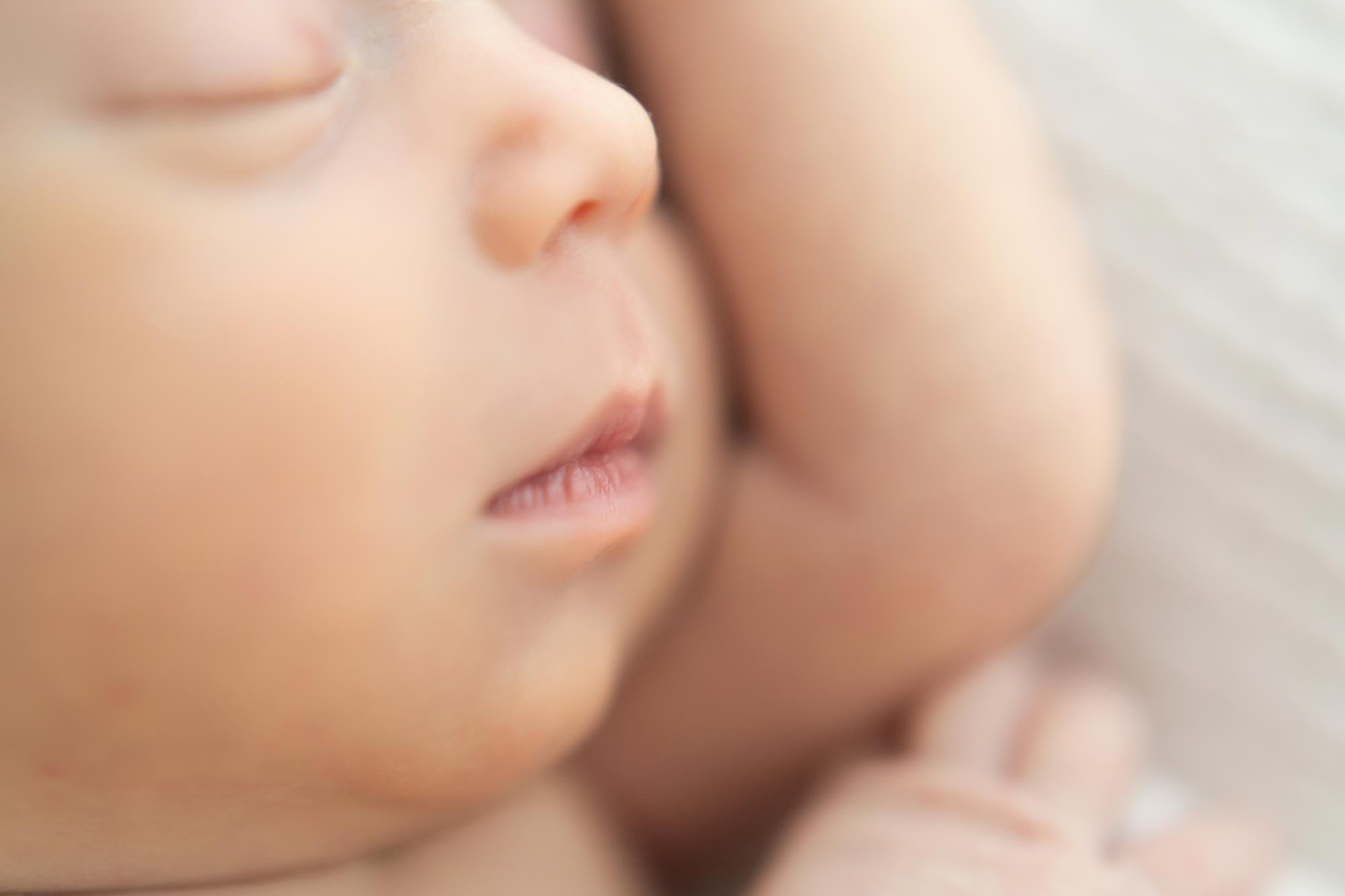 Close up of a newborn baby face Niagara Newborn Photographer.jpg