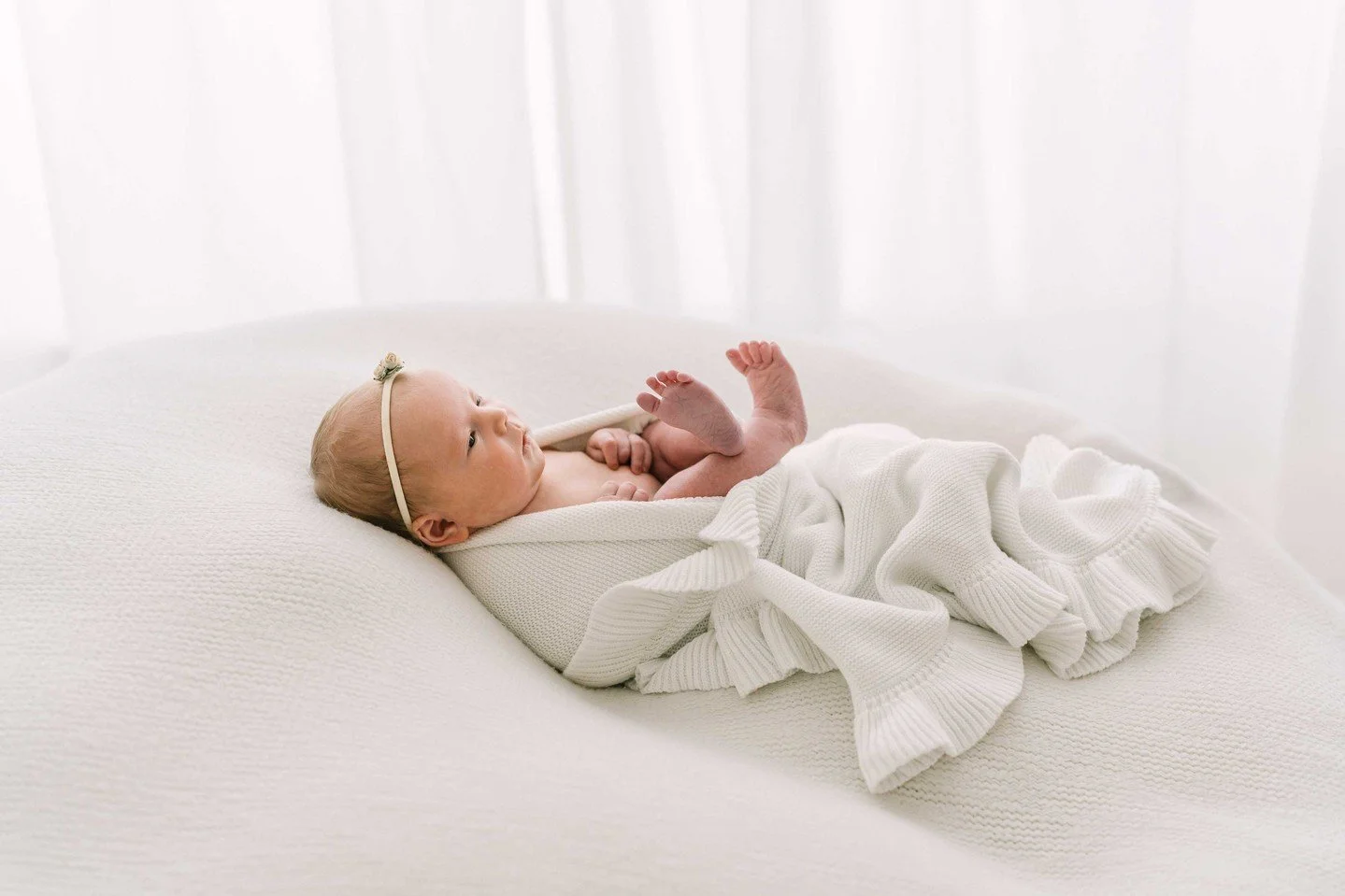 The tiniest details change so quickly.

The curled toes.

The soft lashes.

The way their lips purse when they sleep.

In these first days, everything feels new and fleeting at the same time.

That&rsquo;s why newborn sessions are so gentle and unhur
