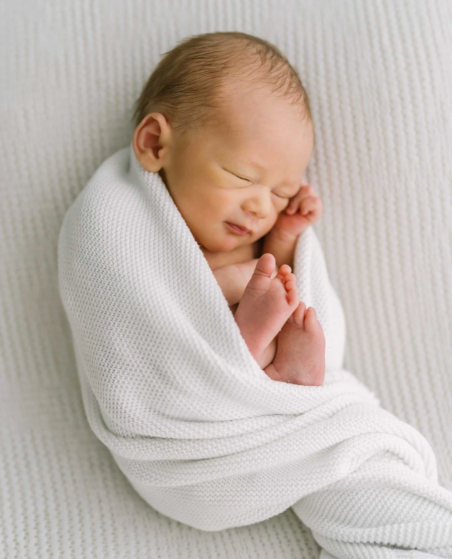 What do you see?⁠
⁠
Is it mama&rsquo;s eyes?⁠
⁠
Is it daddy&rsquo;s nose?⁠
⁠
That little crinkle in the ear that great-grandpa had?⁠
⁠
Every new baby carries pieces of the people who came before them.⁠
⁠
Tiny fingers.⁠
⁠
Soft little feet.⁠
⁠
A whole 