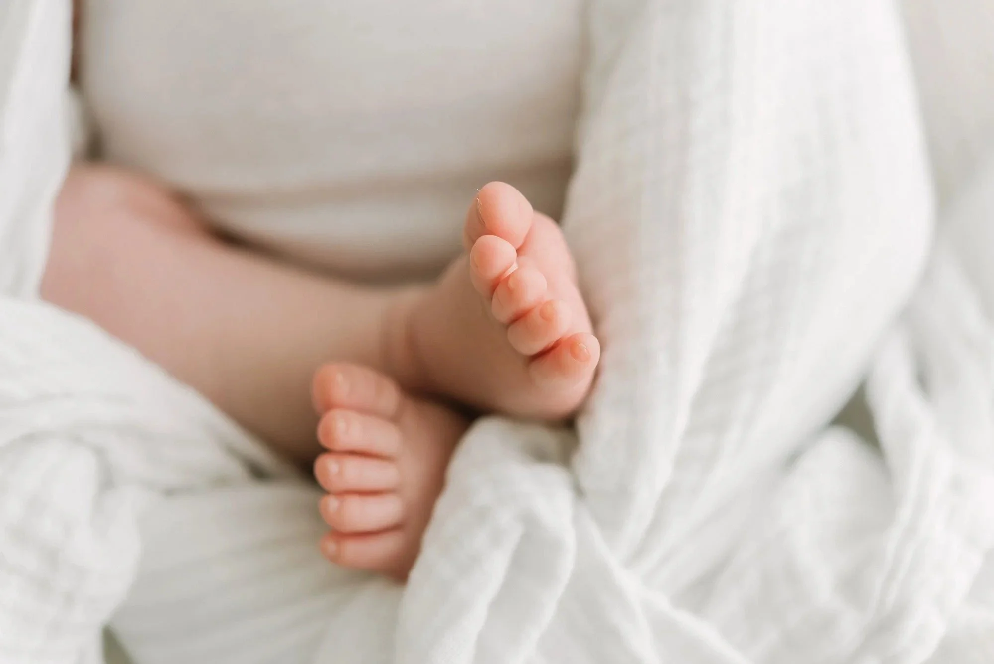 Closeup of newborn baby feet by Hamilton Newborn Photographer at studio by Reflections