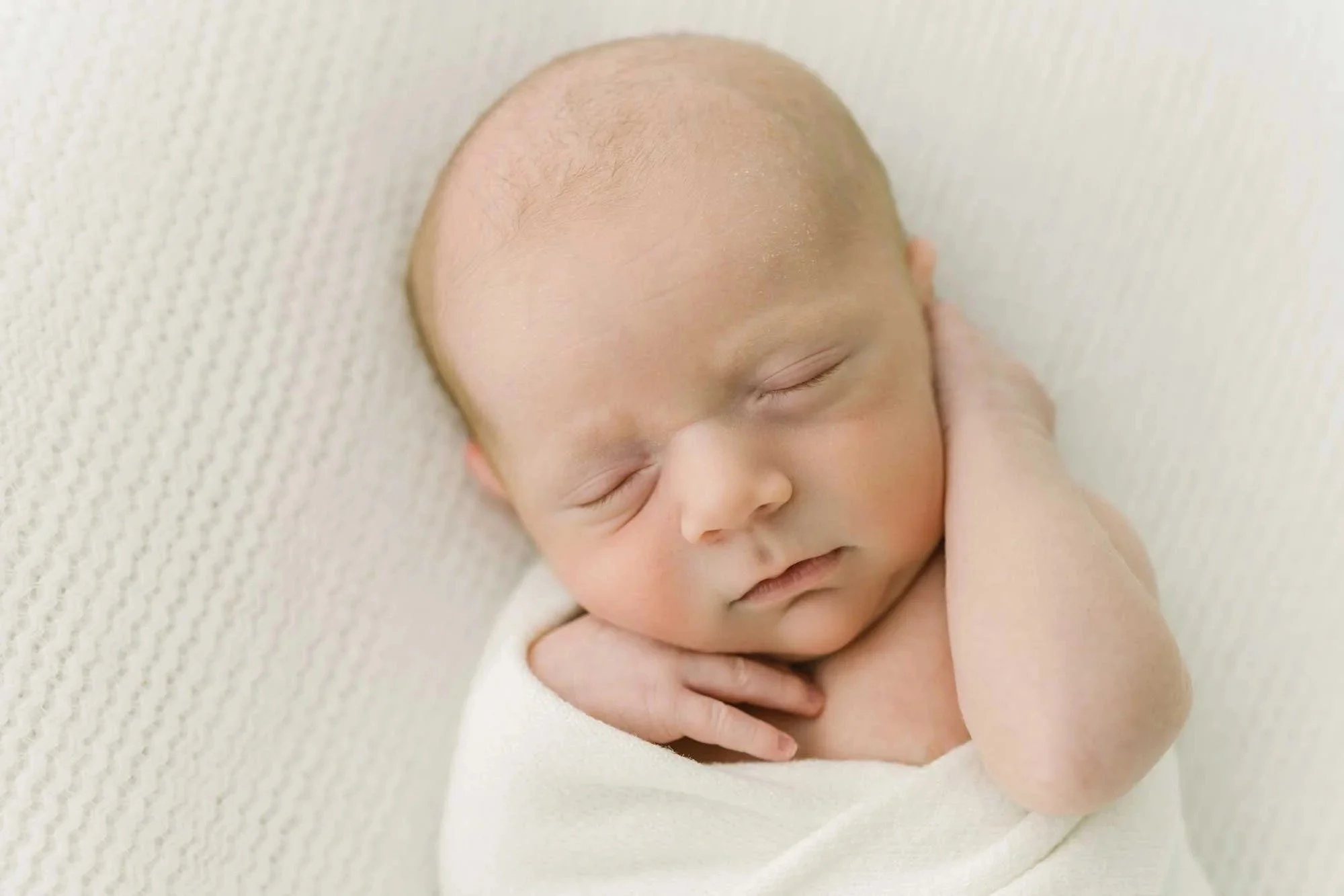 Newborn baby sleeping captured by Hamilton Newborn Photographer at studio by Reflections