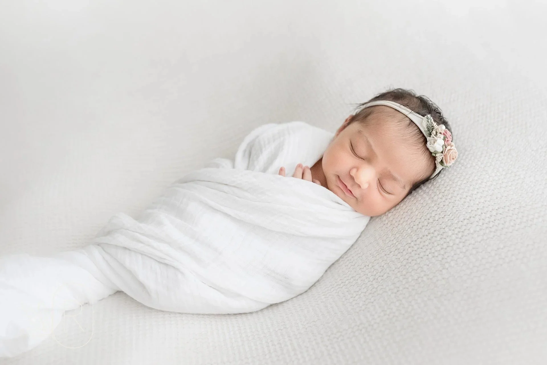 Sleeping baby captured by Reflections newborn photography in Hamilton​