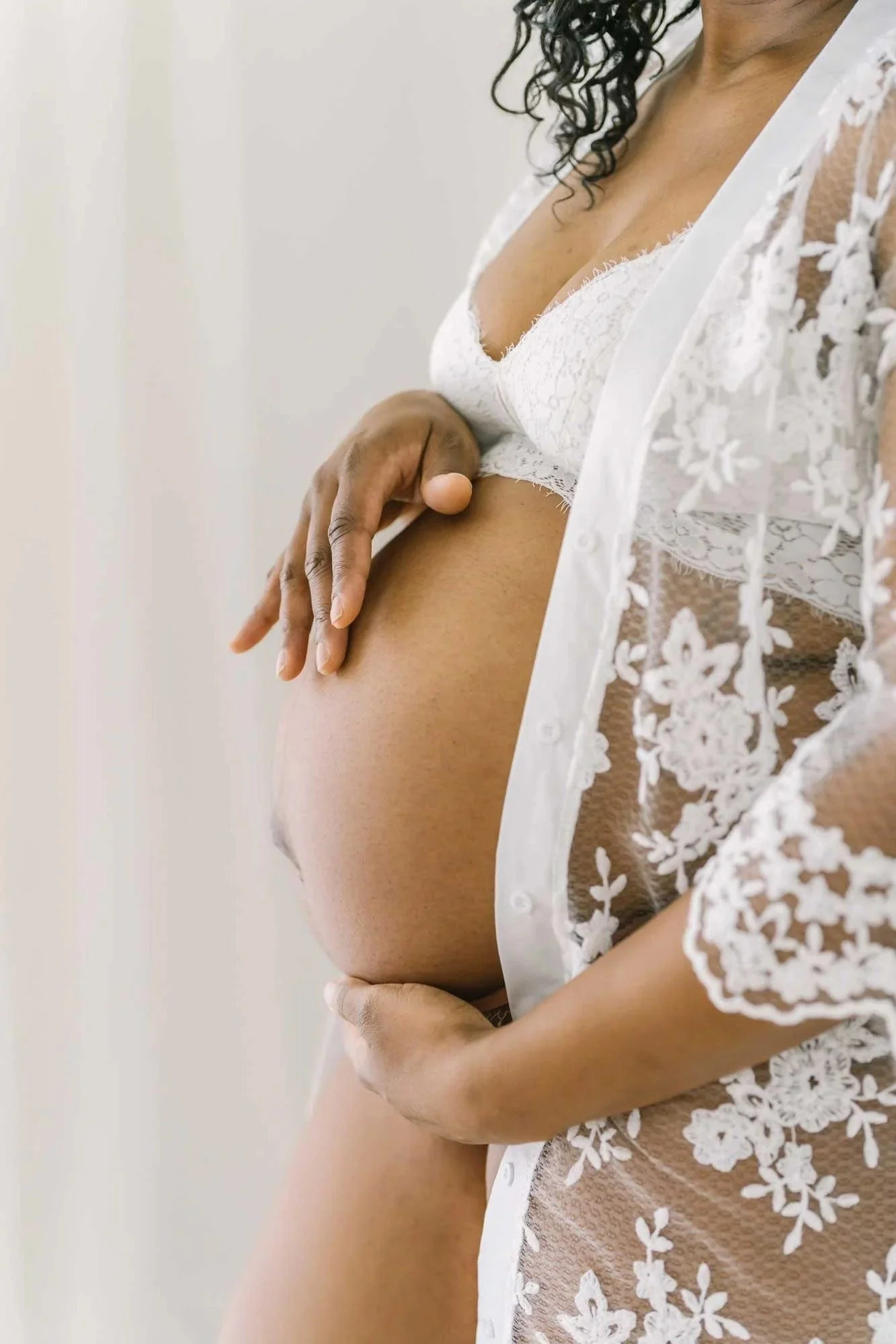 Studio photos of a pregnant mom posing for maternity photography in the Niagara Region at Reflections studio