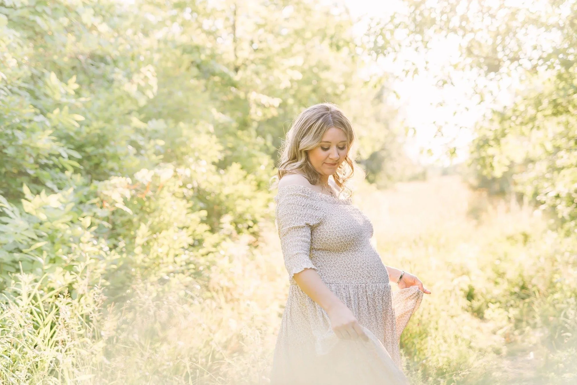 Niagara Maternity Photography of a beautiful glowing mama in flowy dress forest of trees  