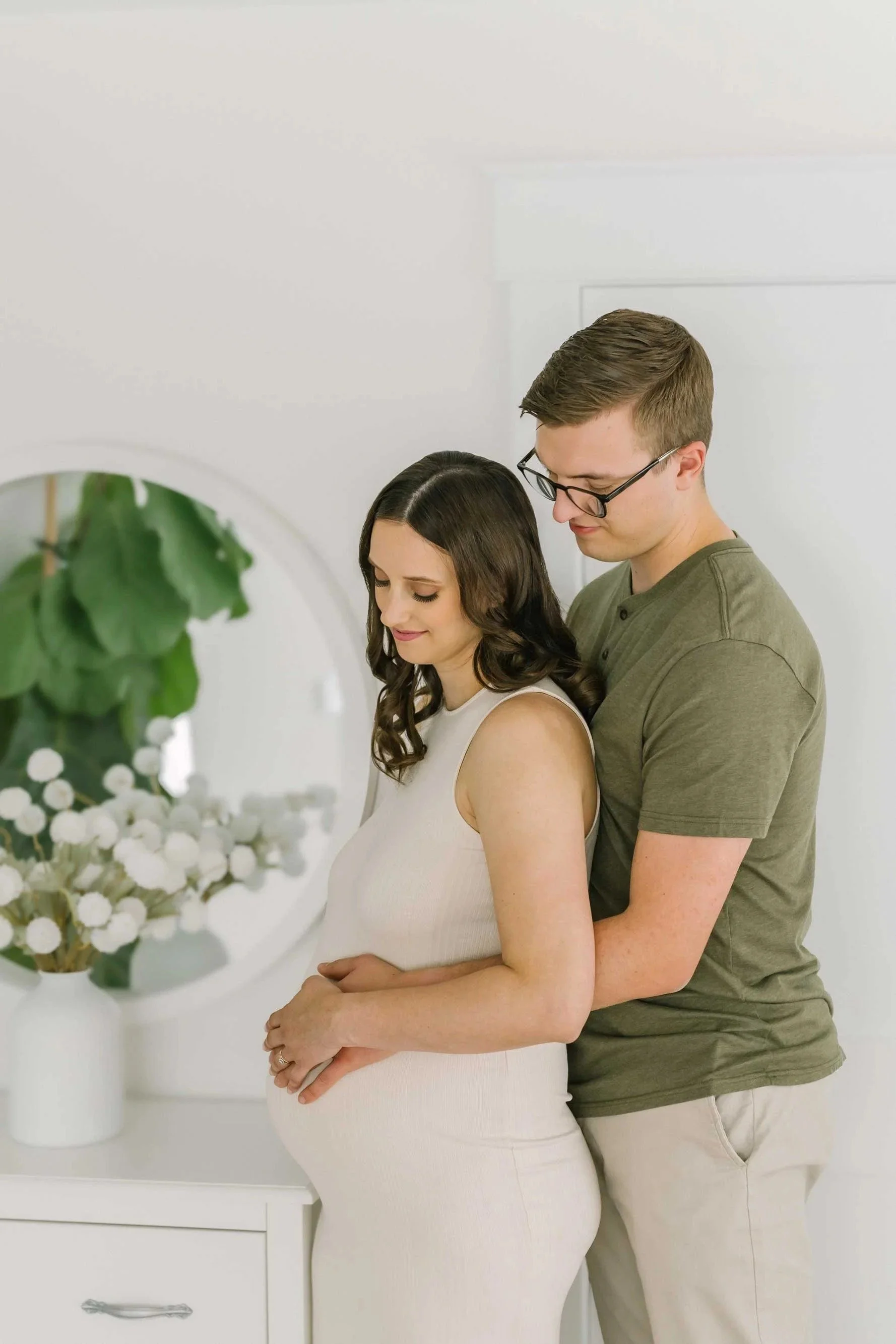 Couple posing for Niagara Maternity Photography in their nursery