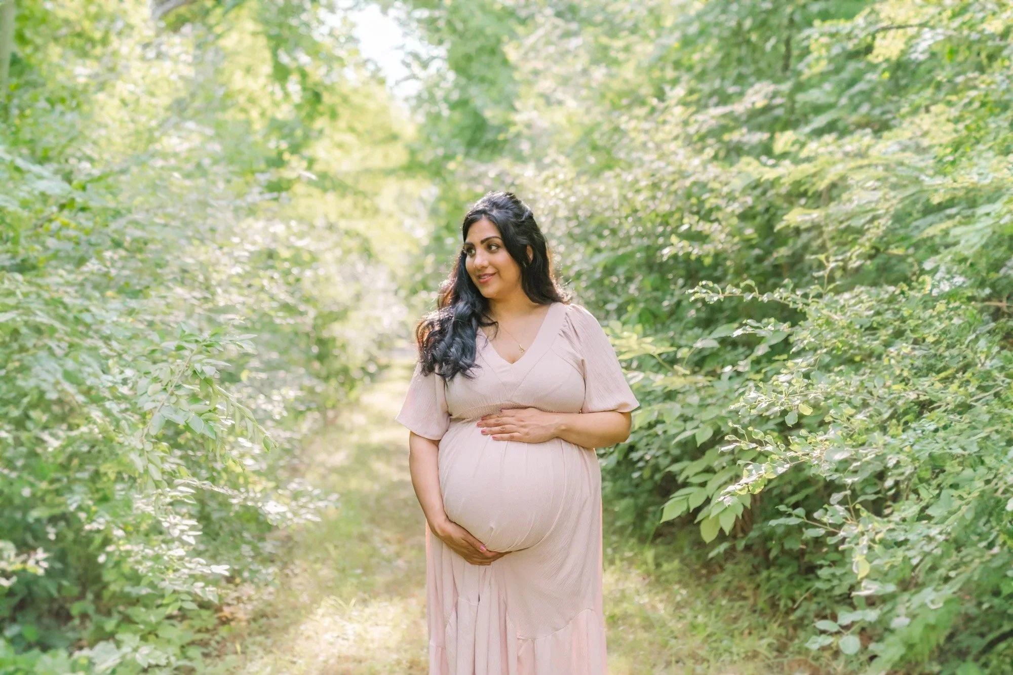 Mom posing for Niagara Maternity Photography in the forest