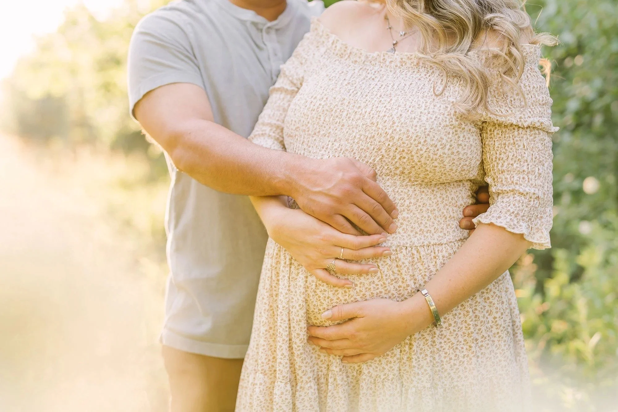 Niagara Maternity Photography in Ontario in a forest of trees and greenery during golden hour