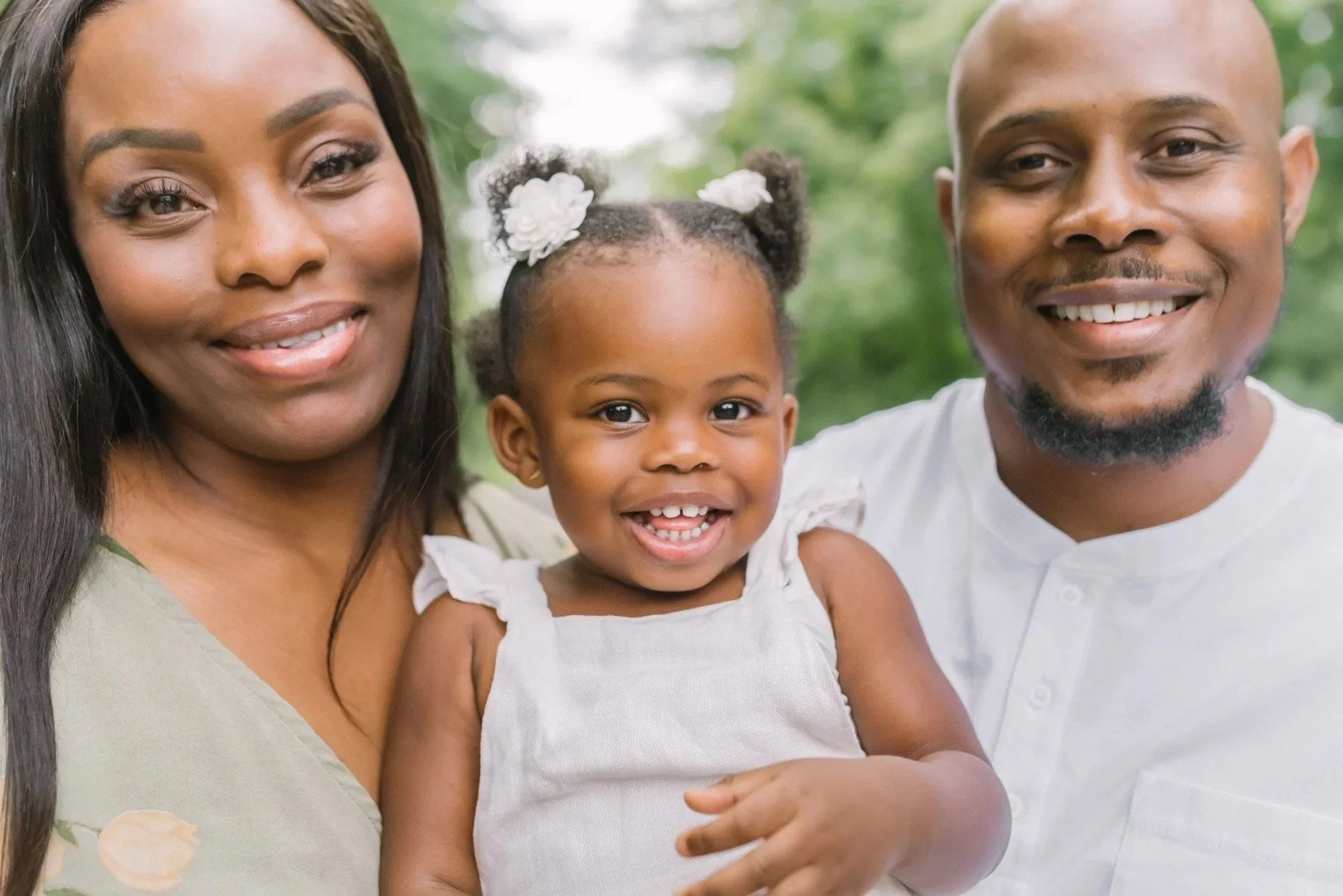 Family smiling together captured by niagara family photographer, Reflections Photography