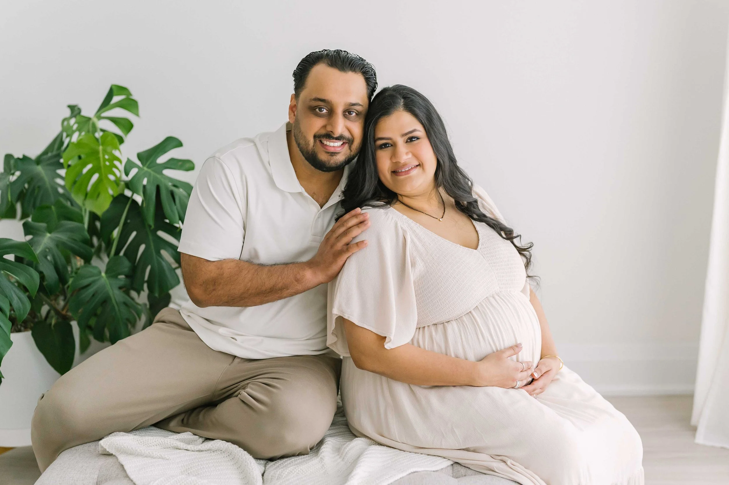 Full-service maternity photography session in Grimsby featuring professional hair, makeup, wardrobe styling, and timeless pregnancy portraits.