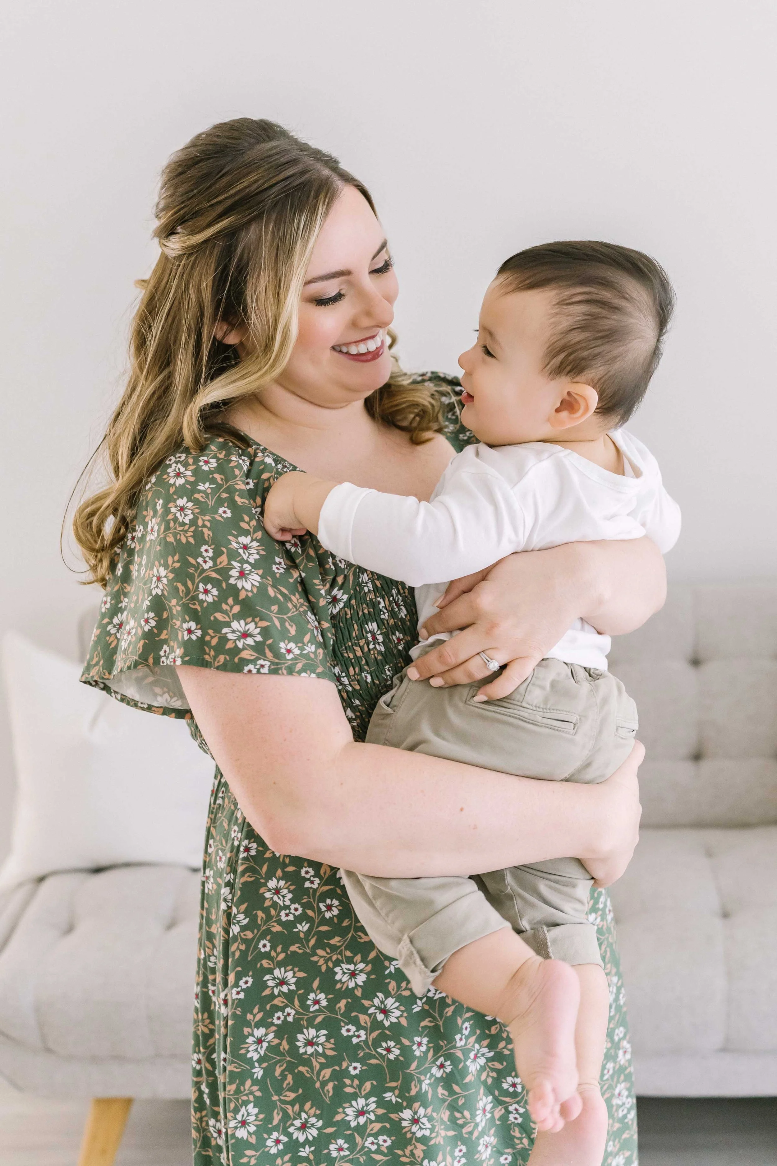 Emotional mother and baby portrait capturing the loving bond between mom and her one-year-old son during a milestone session in Niagara.