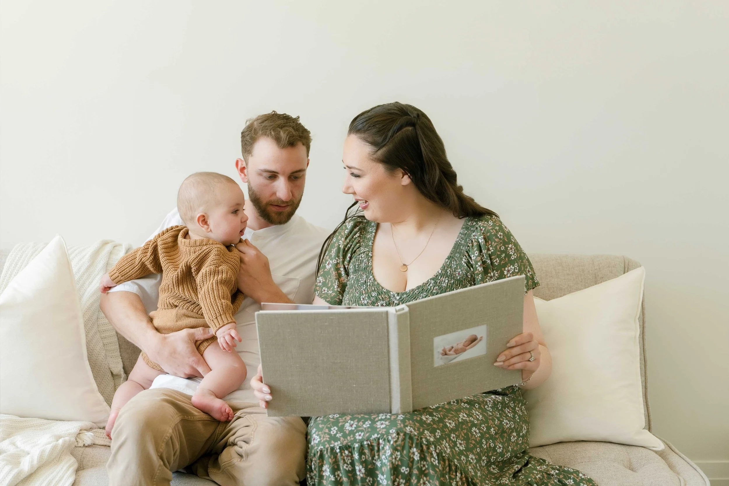 Parents Viewing Custom Heirloom Photo Albums in Ontario