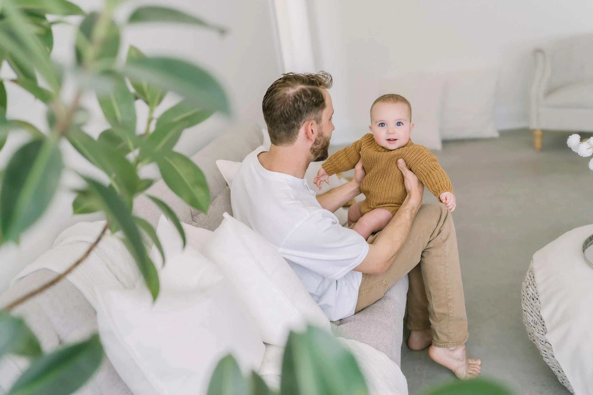 Heartwarming dad and baby bonding portrait captured during baby photography session