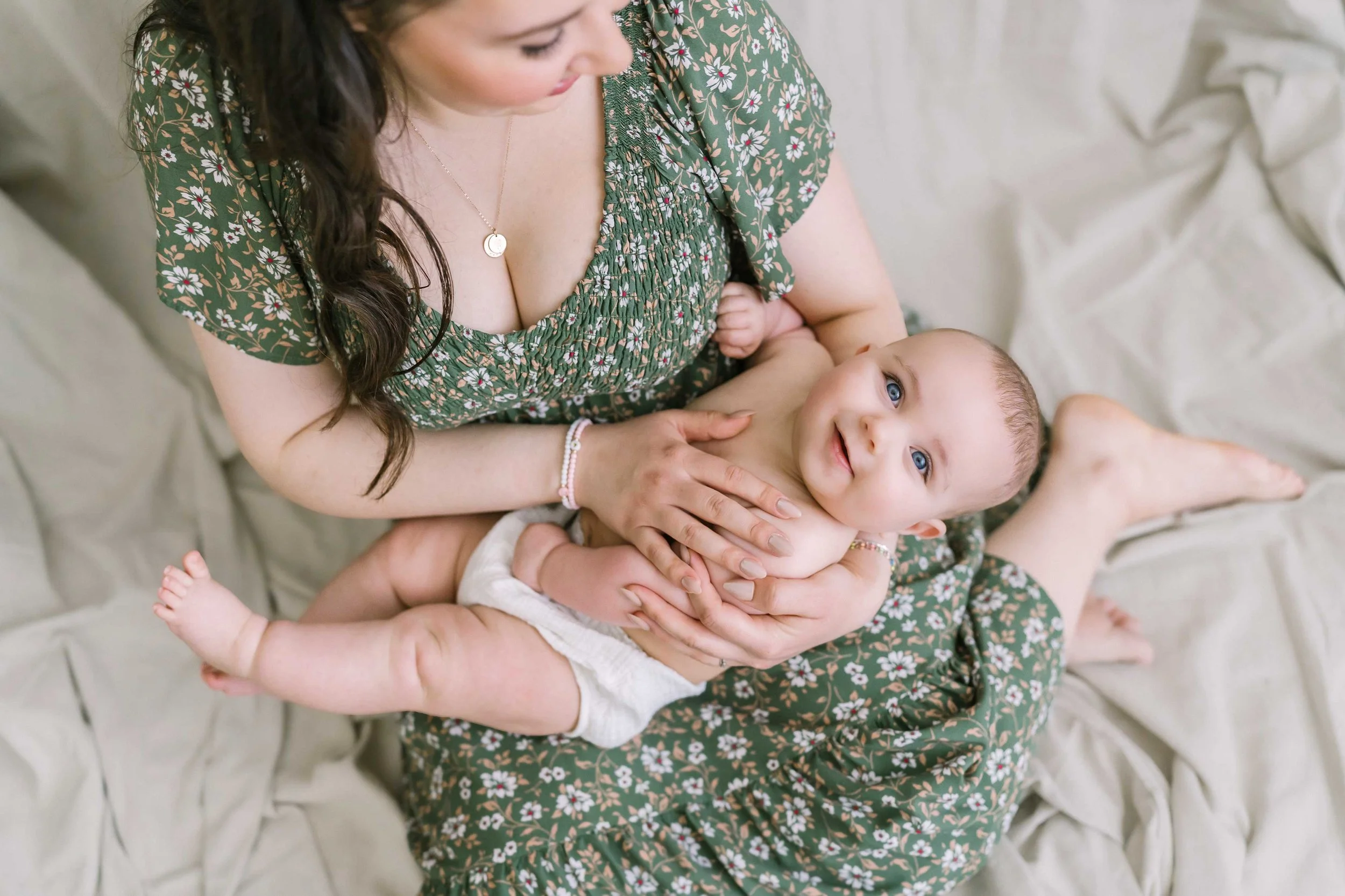 Creative mirror image showcasing parent and baby connection during photo session