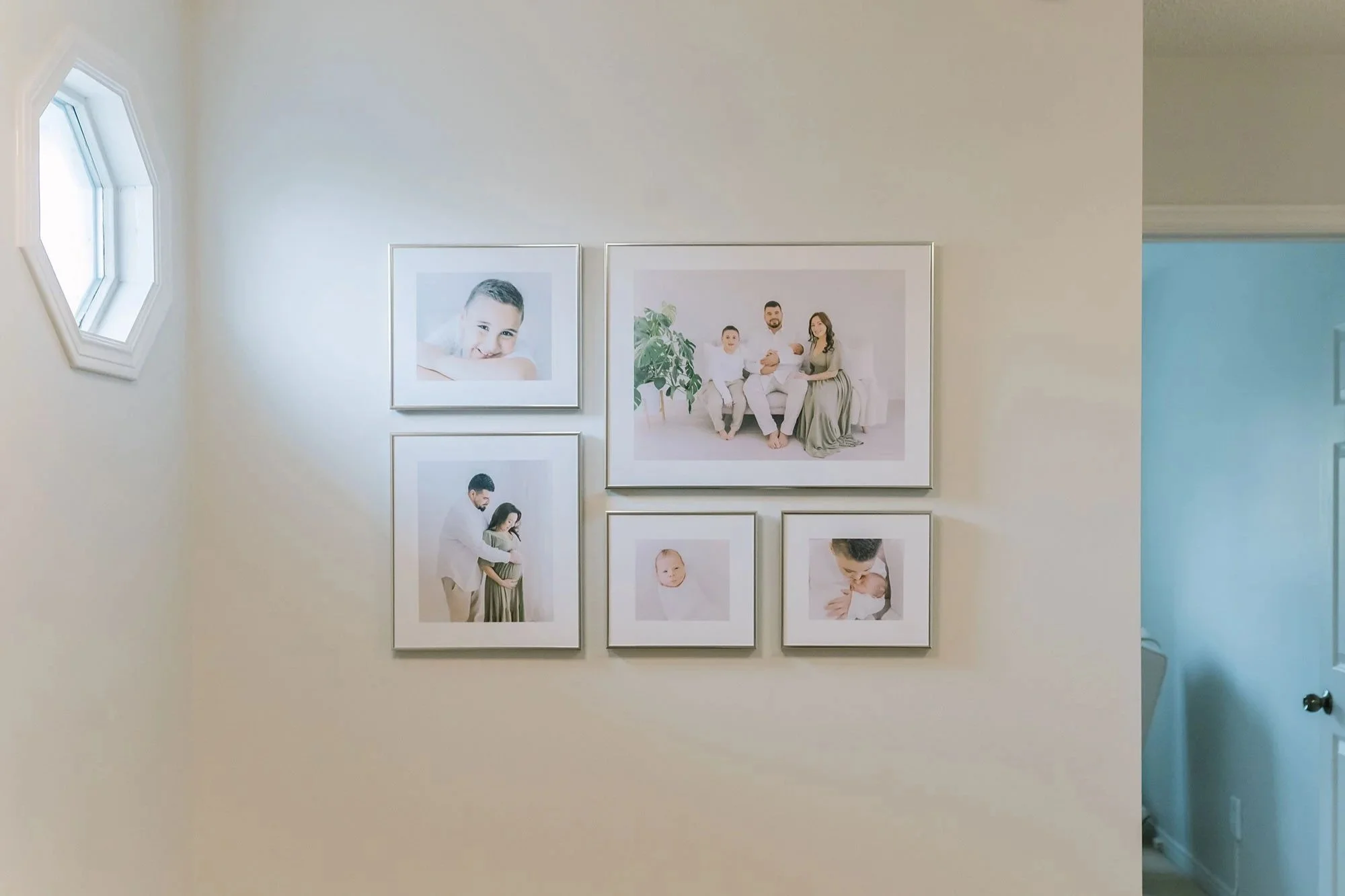 Gallery Wall Featuring Heirloom Newborn Photo Albums in Niagara