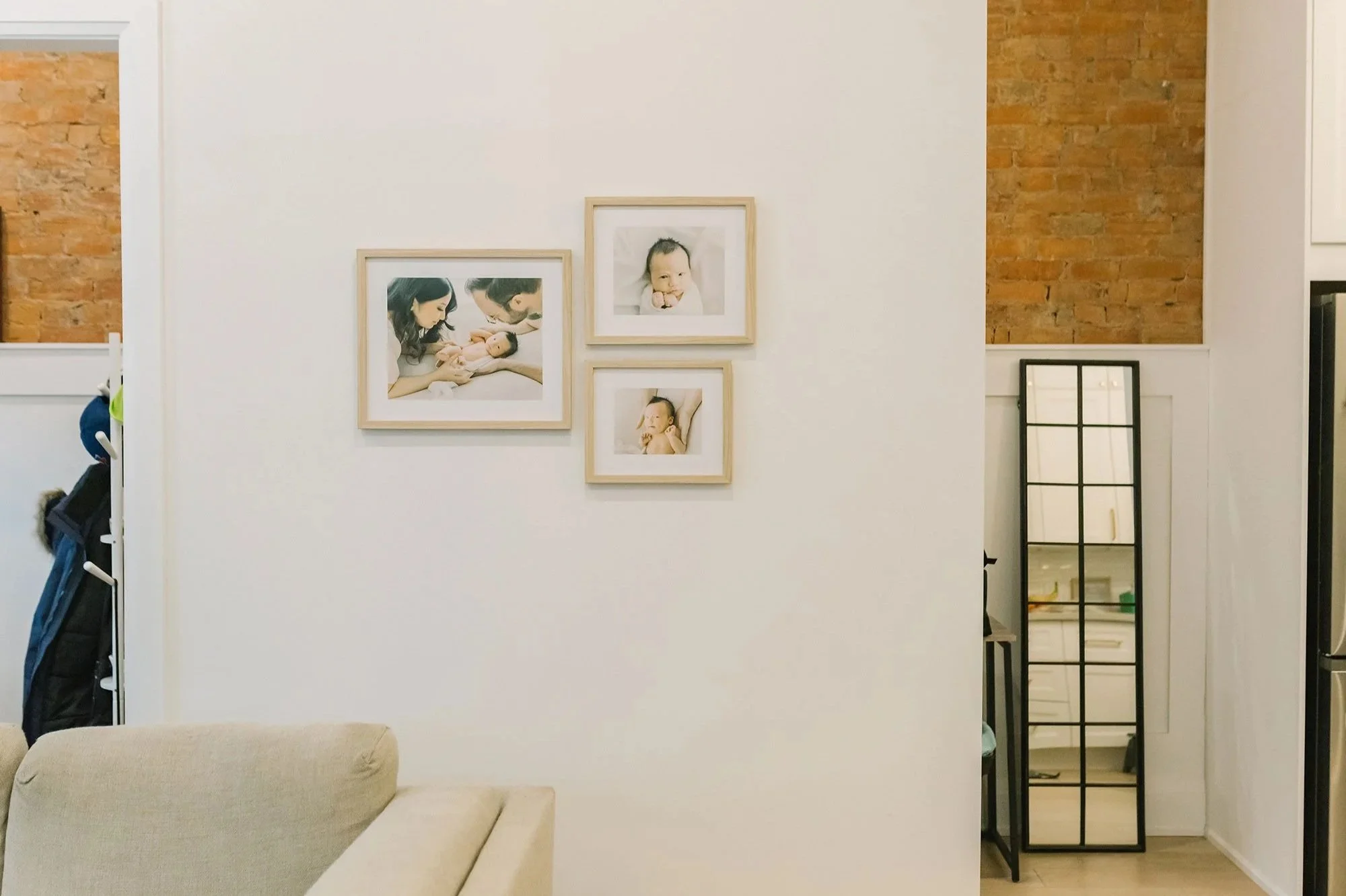 Living Room Gallery Wall Featuring Heirloom Photo Albums from Niagara