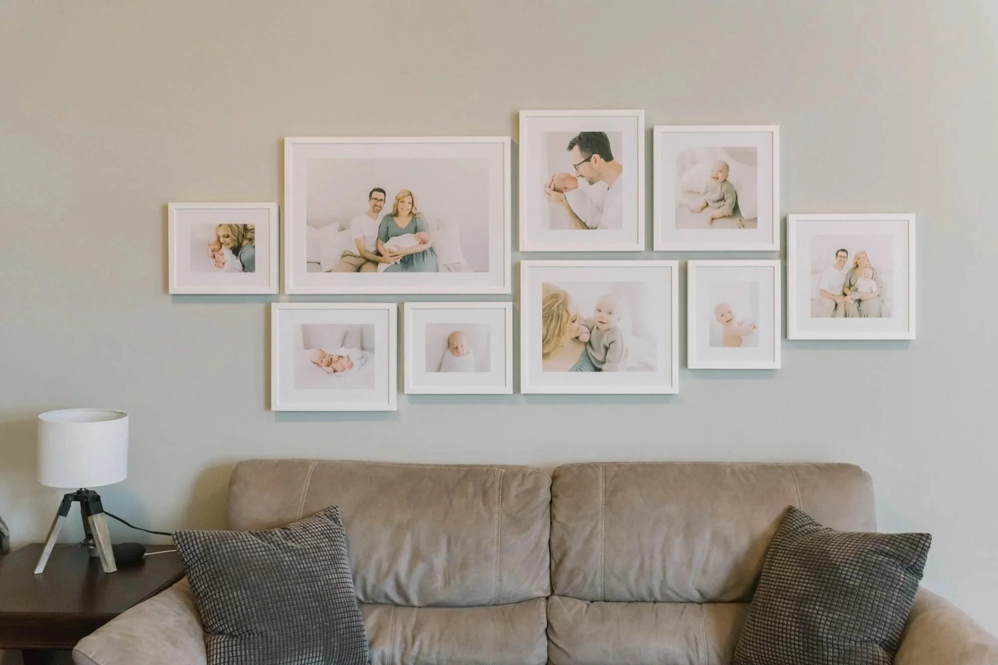 Gallery Wall Above Couch Showcasing Heirloom Photo Albums in Ontario