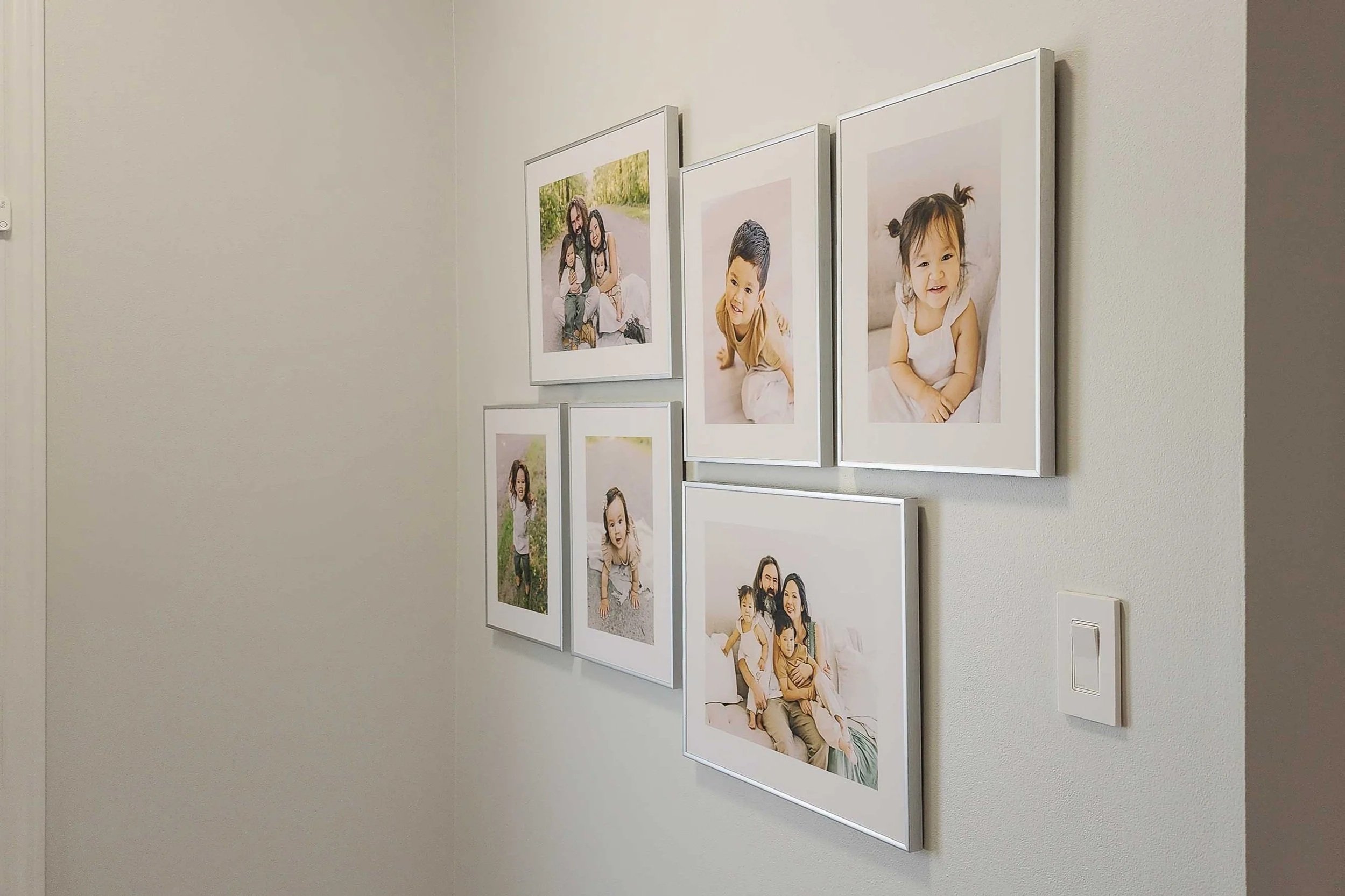 Hallway Gallery Wall Featuring Custom Heirloom Photo Albums in Niagara