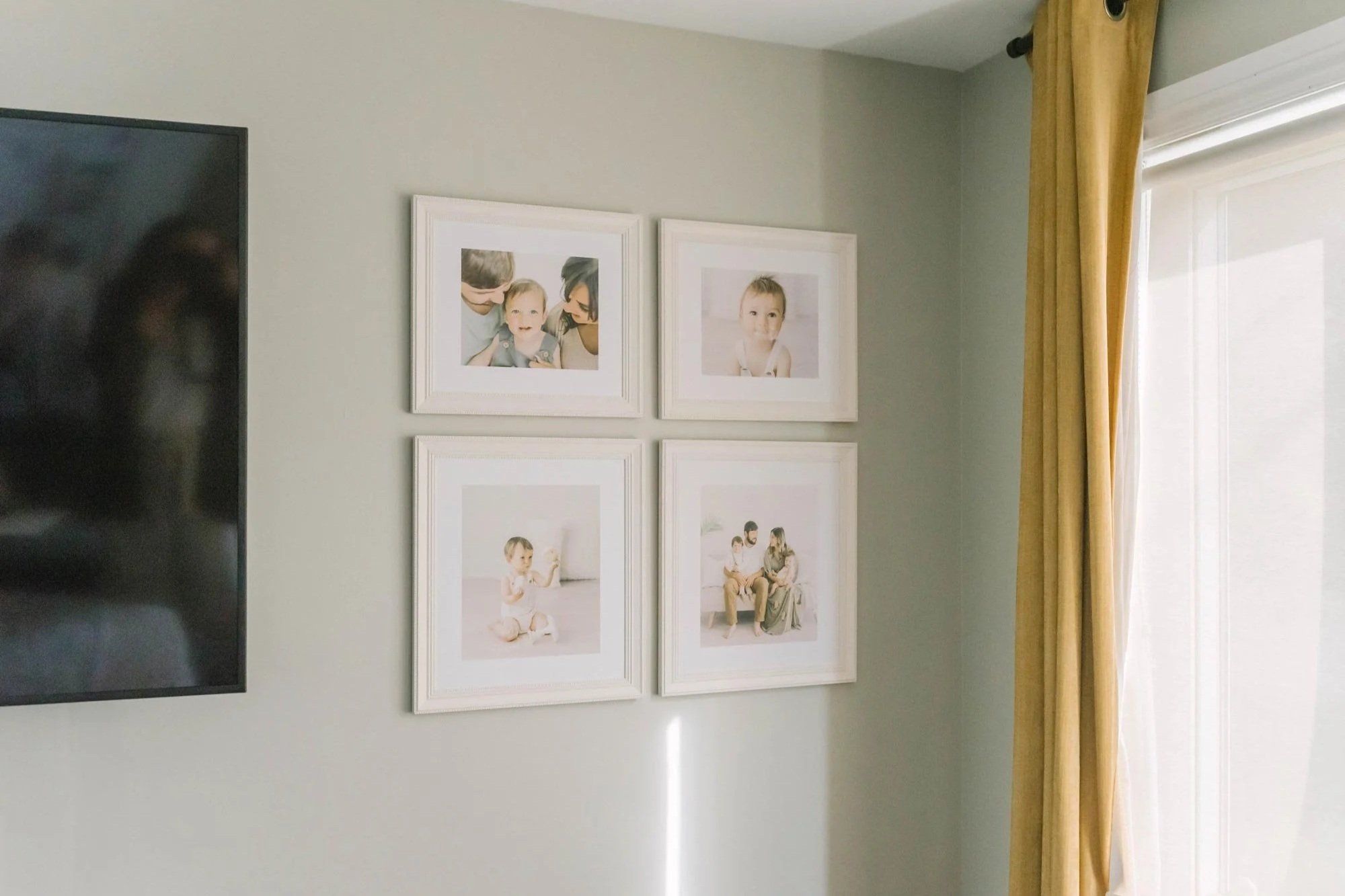 Framed Portrait Wall Styled for Heirloom Wedding Photo Albums in Ontario