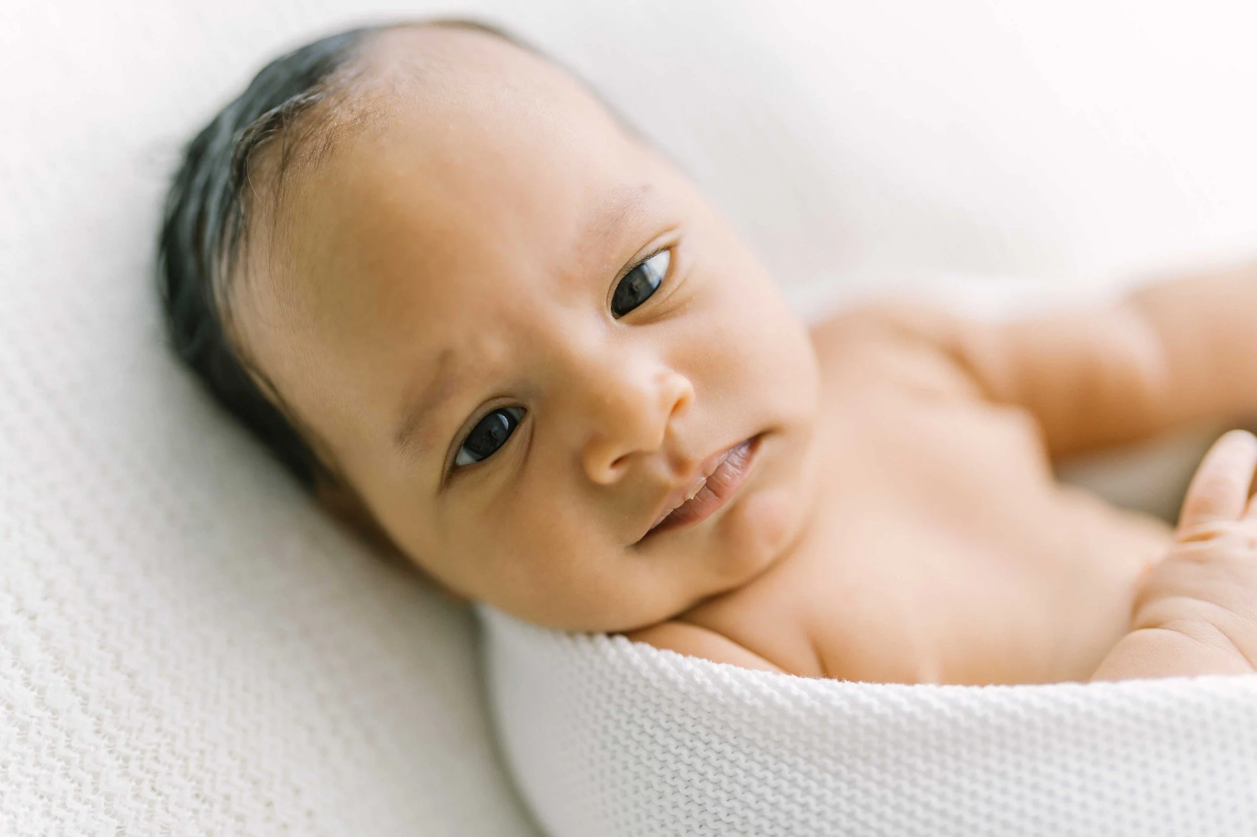 Awake newborn making direct eye contact at Reflections Photography Grimsby
