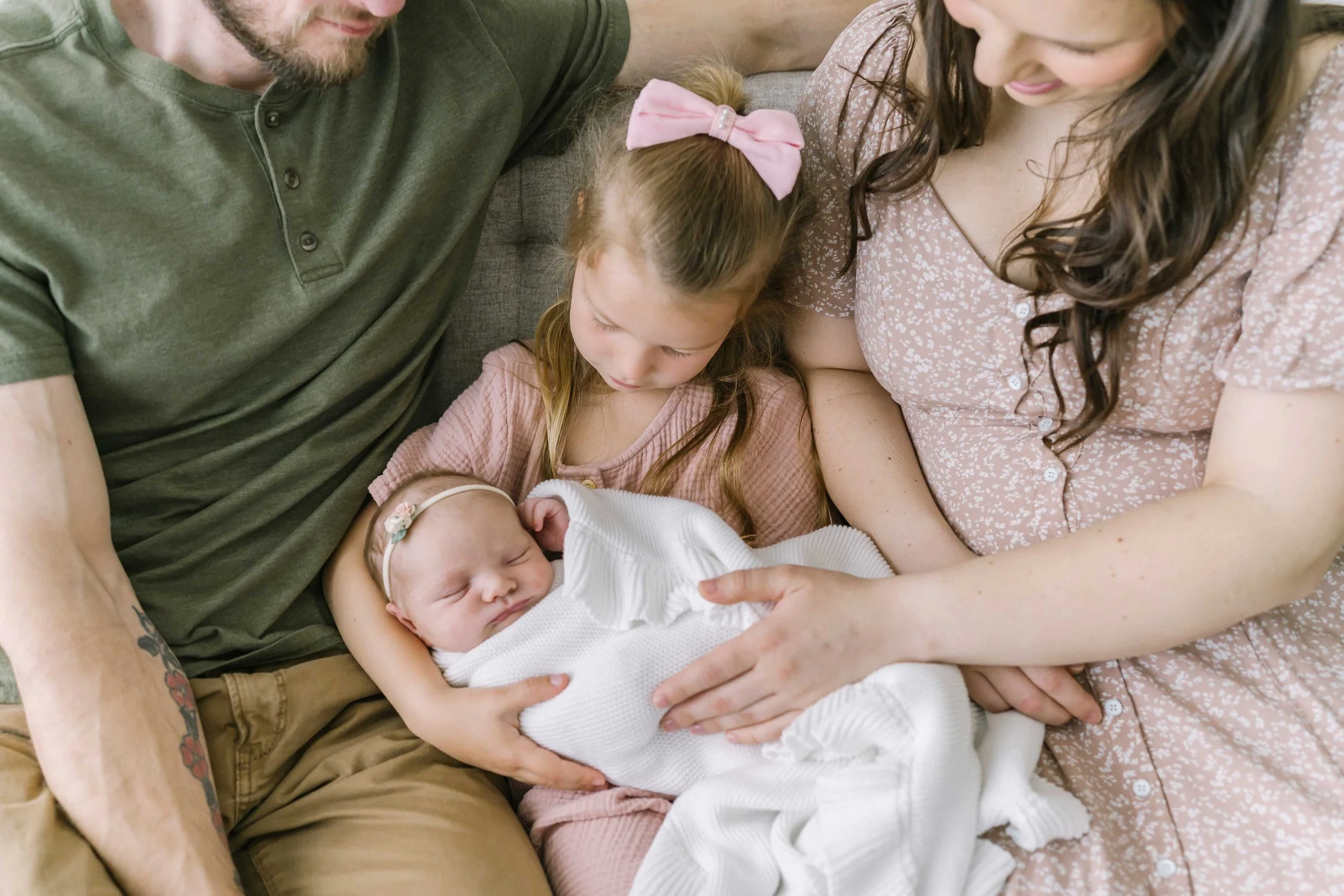 Newborn baby with parents during a Grimsby photography session