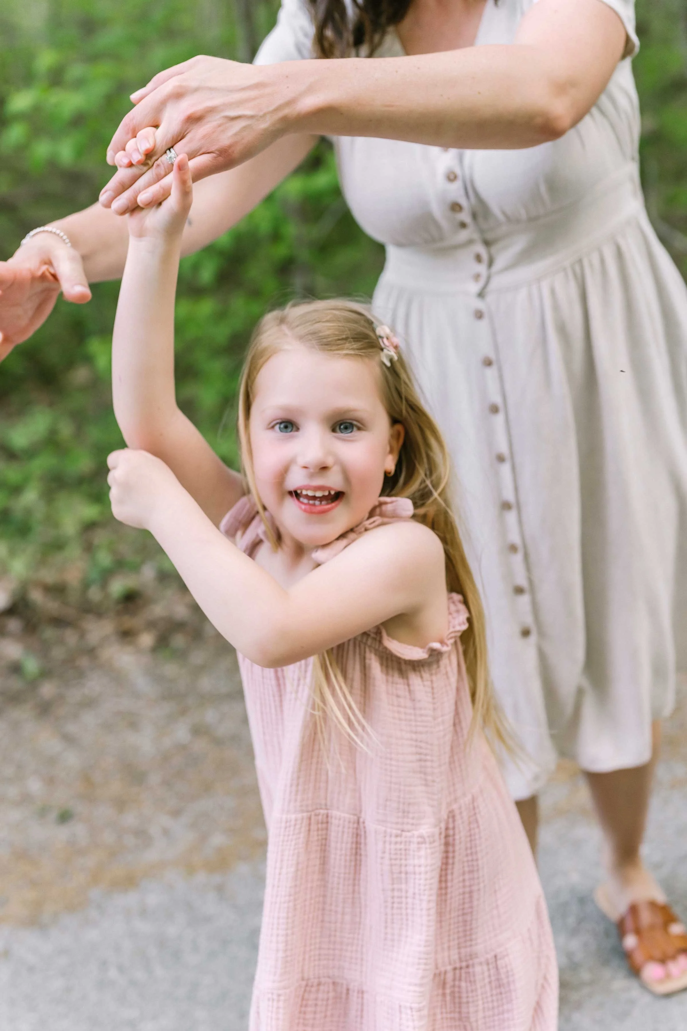 Family enjoying natural light and movement during an outdoor session in Niagara
