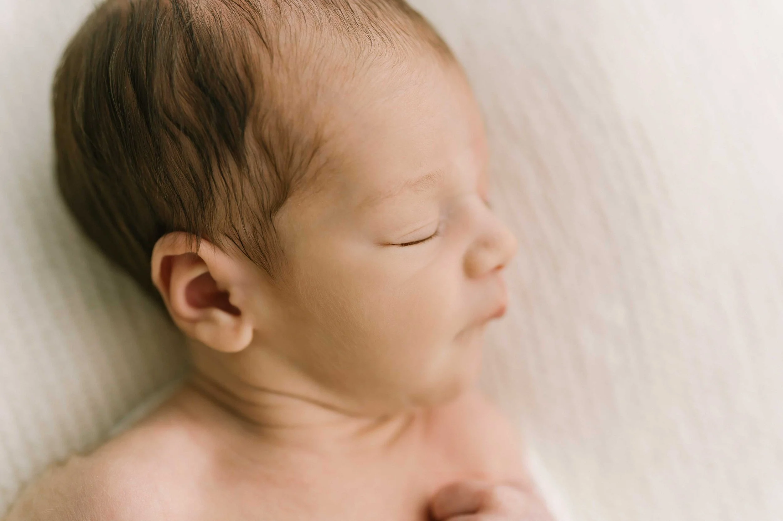 Chong newborn baby peacefully sleeping during a Grimsby photography session