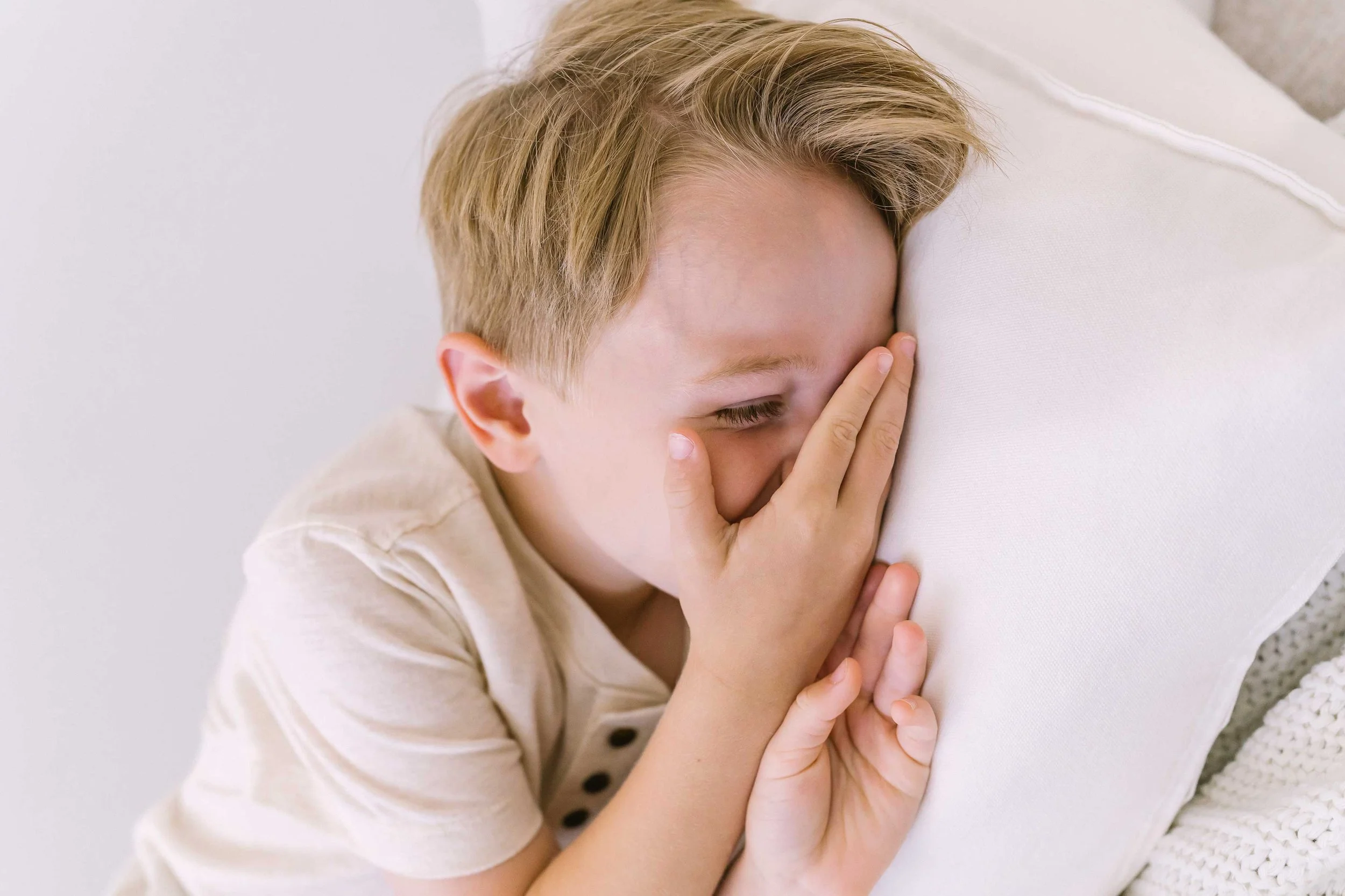 Lupia big brother laughing during a newborn sibling photography session