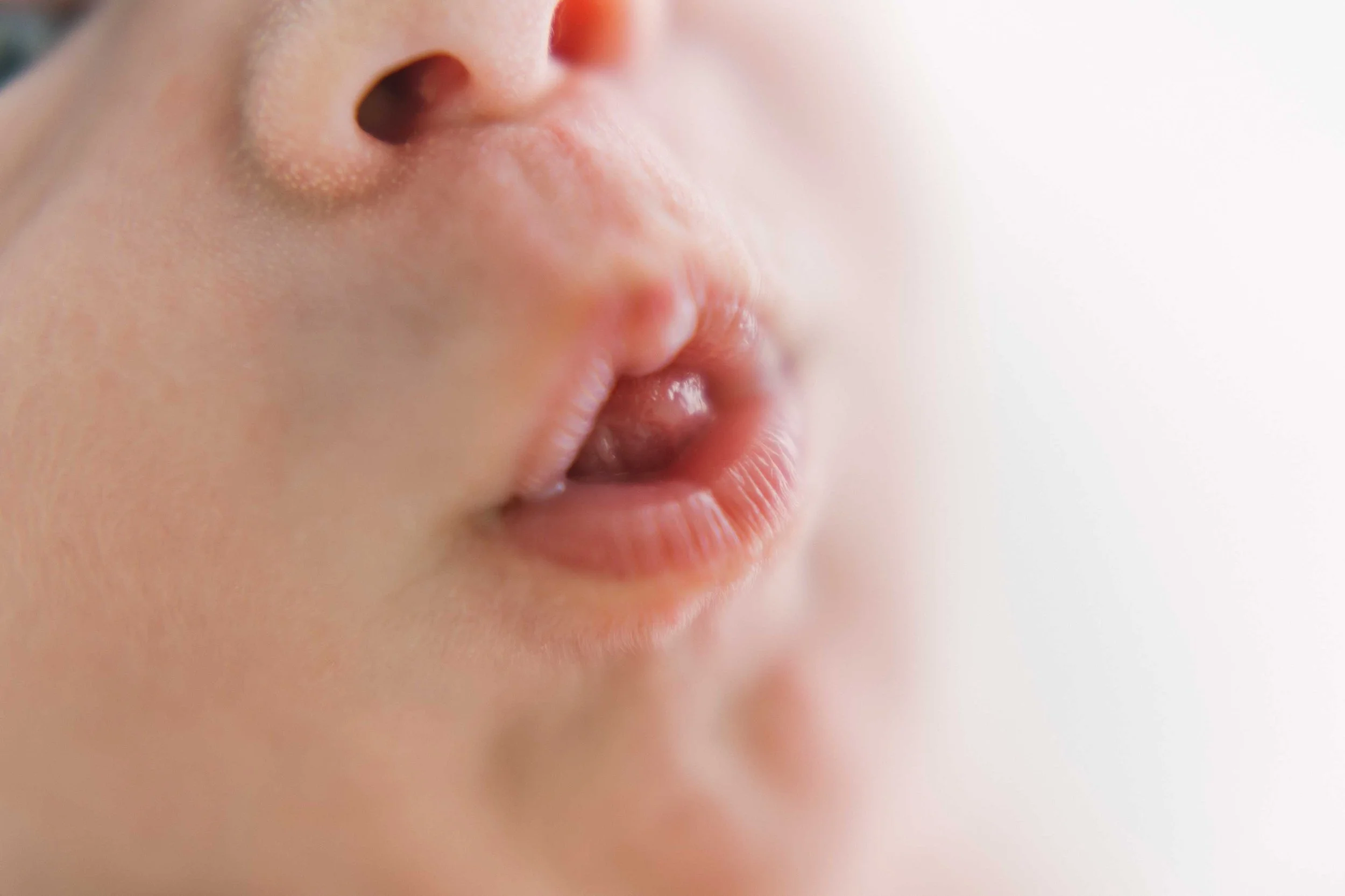 Close-up portrait of Chong newborn baby’s tiny lips
