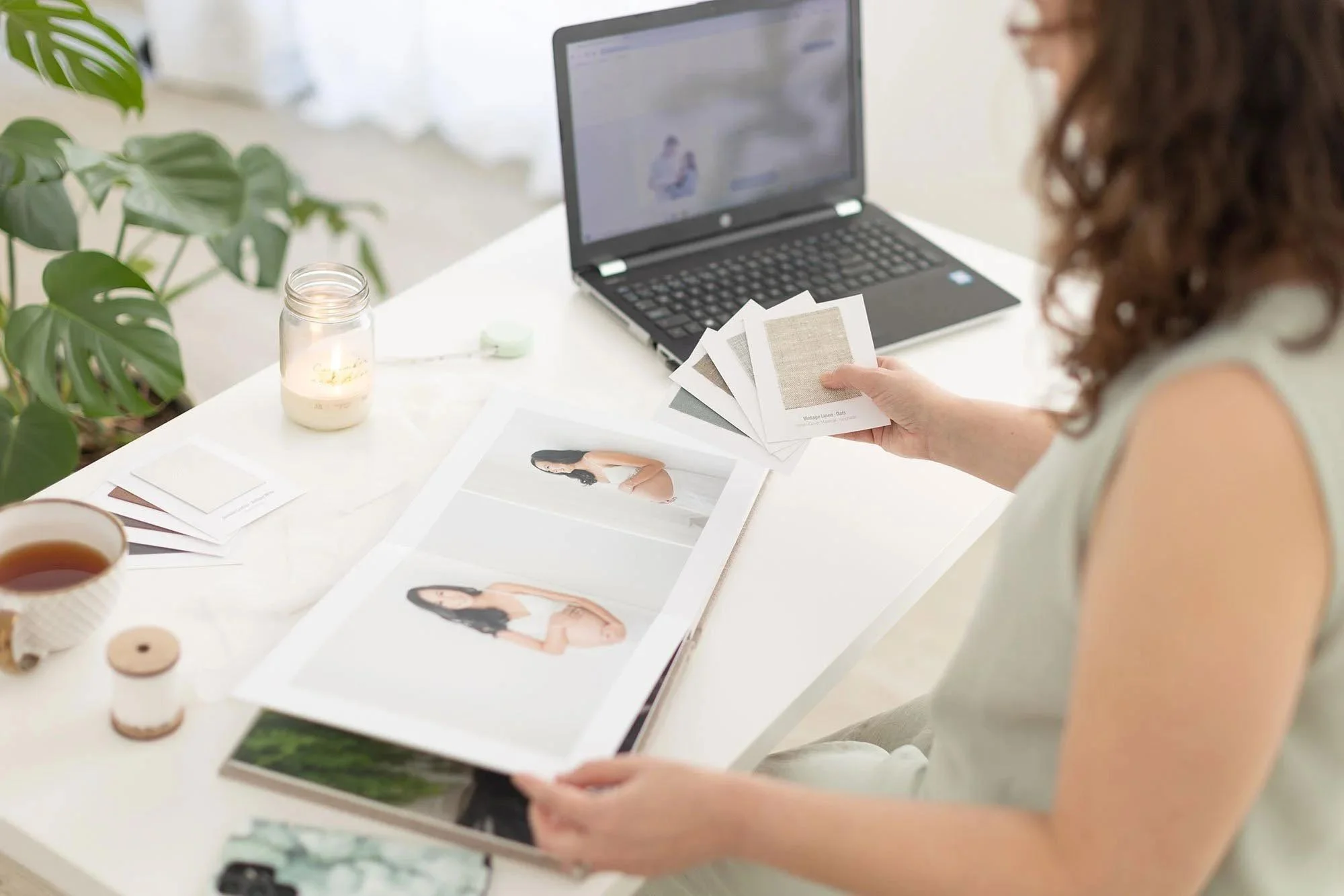 Best maternity photographers in Niagara designing artwork after maternity session in the photography studio near me.