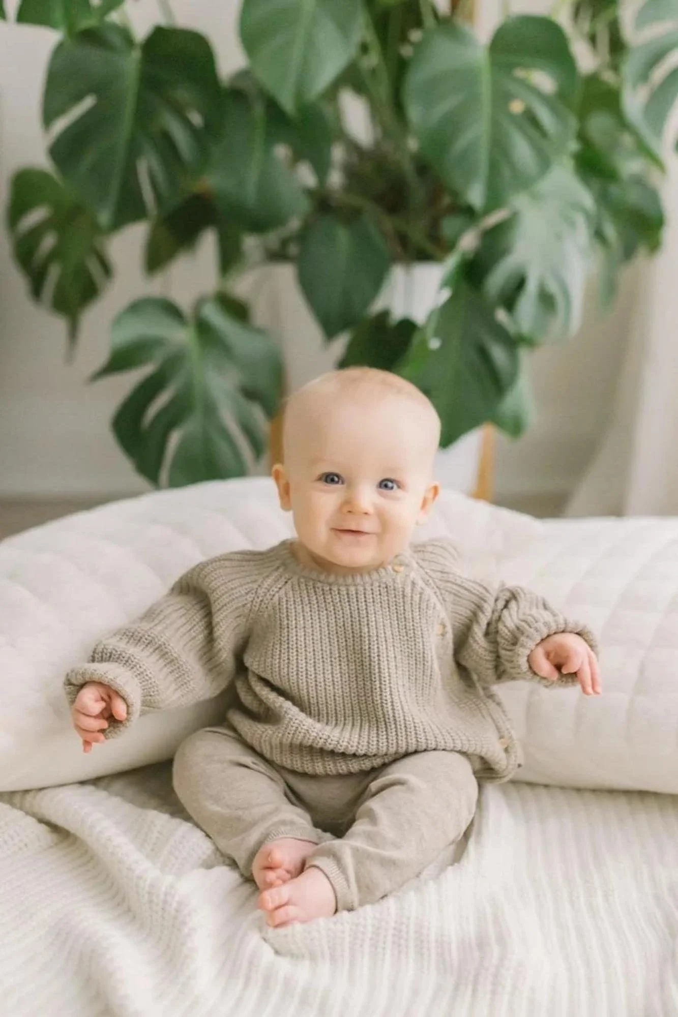 Little boy smiling at photo studio for family photography in Hamilton at Reflections​