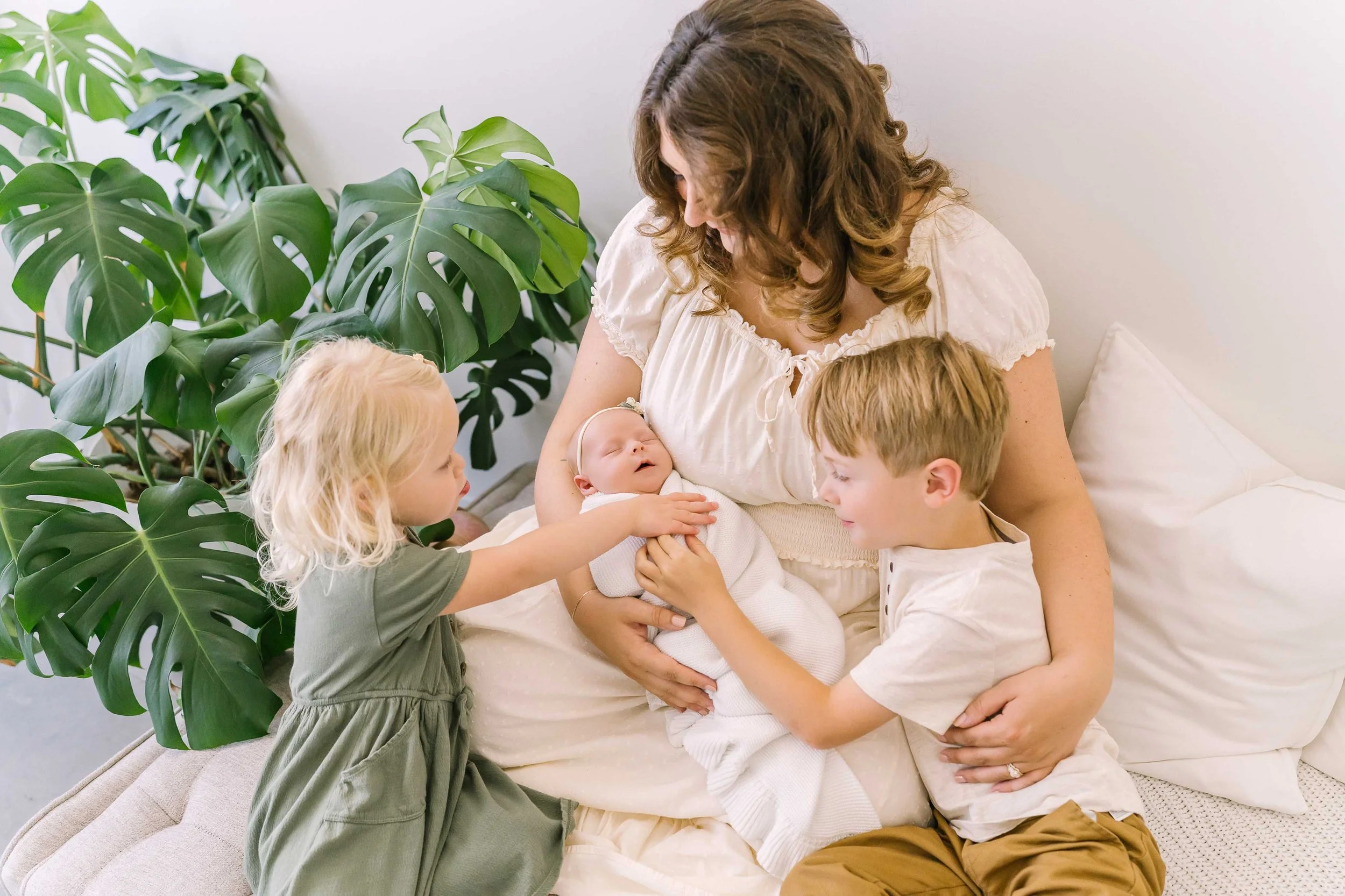 Lupia mother holding her newborn baby girl during a Niagara photography session
