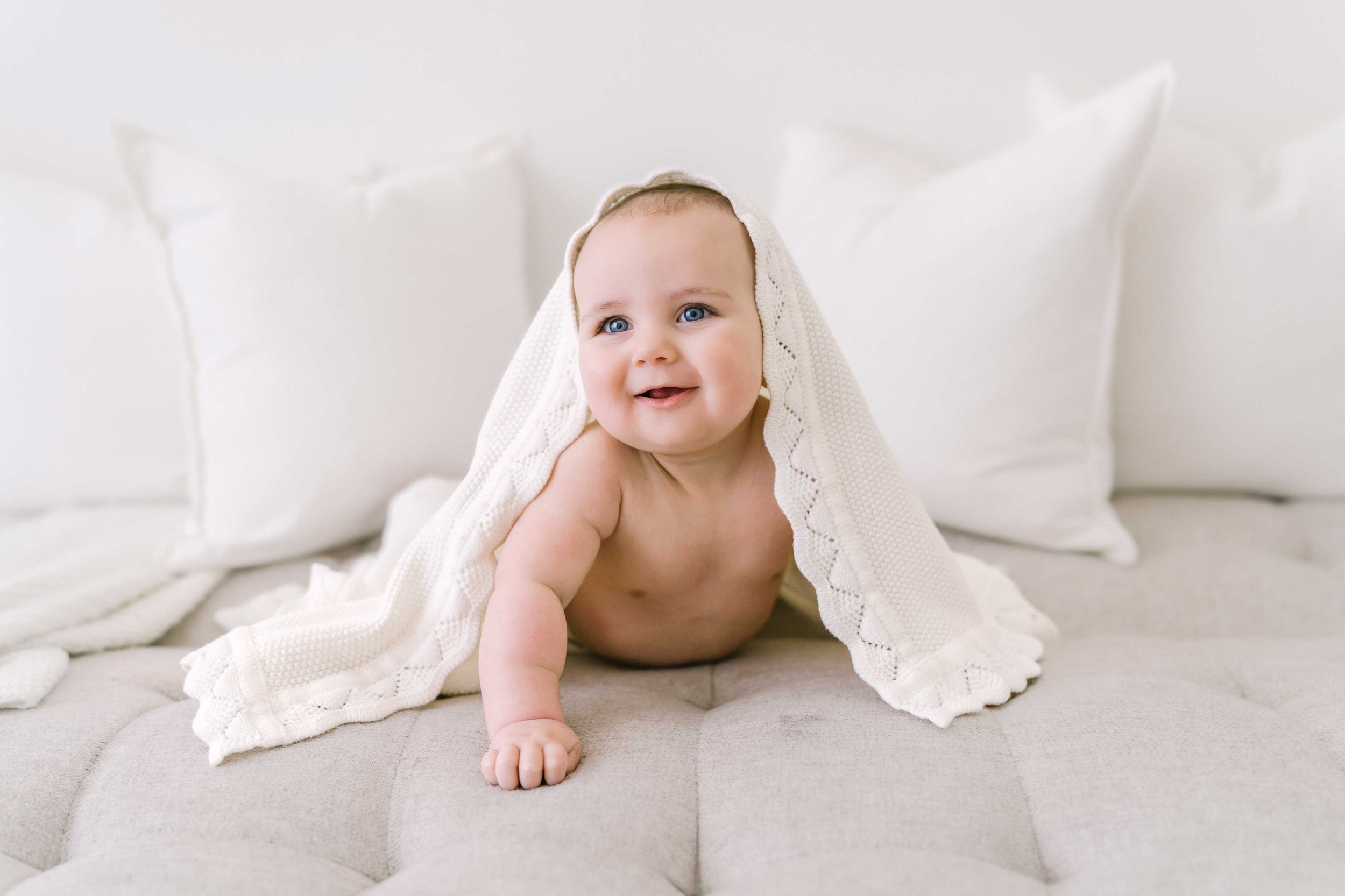 Playful father and baby laughter captured in professional Grimsby baby photoshoot