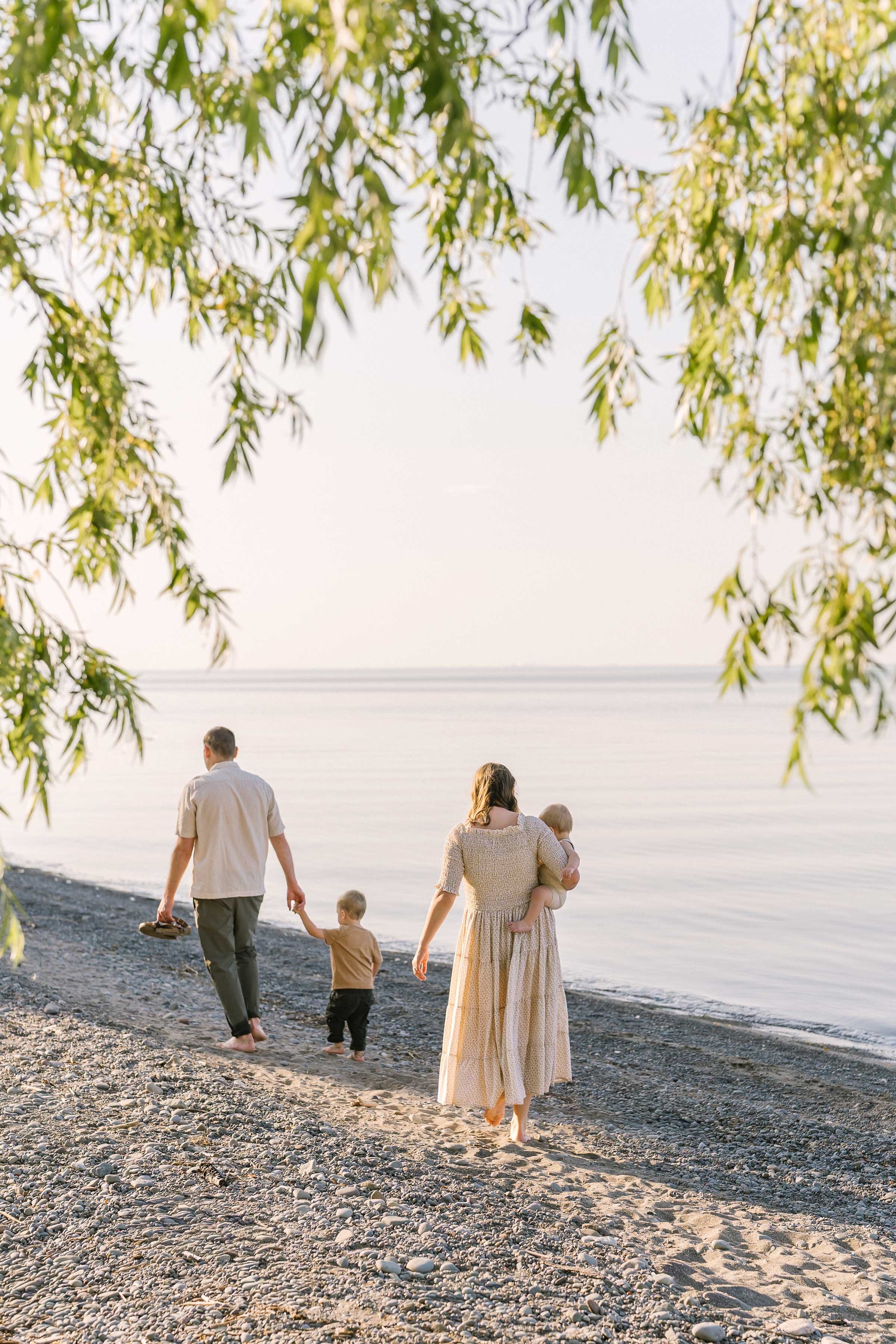 Chute family walking along the shoreline in Niagara