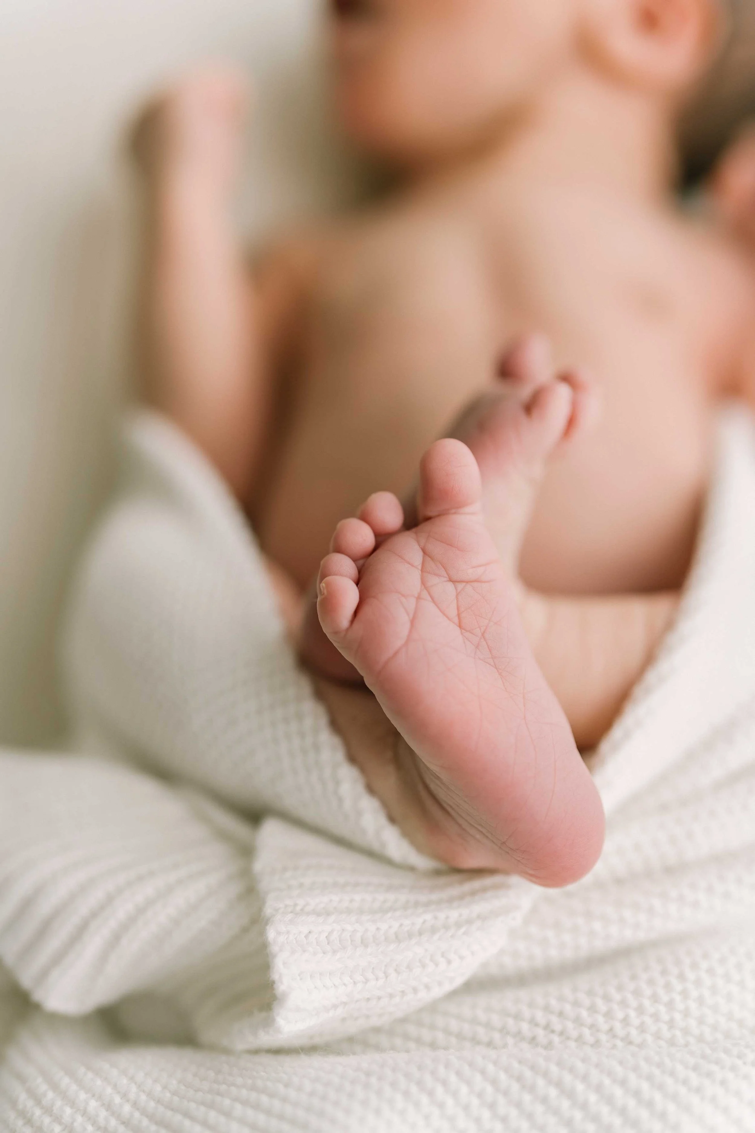 Close-up of Chong newborn baby’s tiny feet during newborn photography