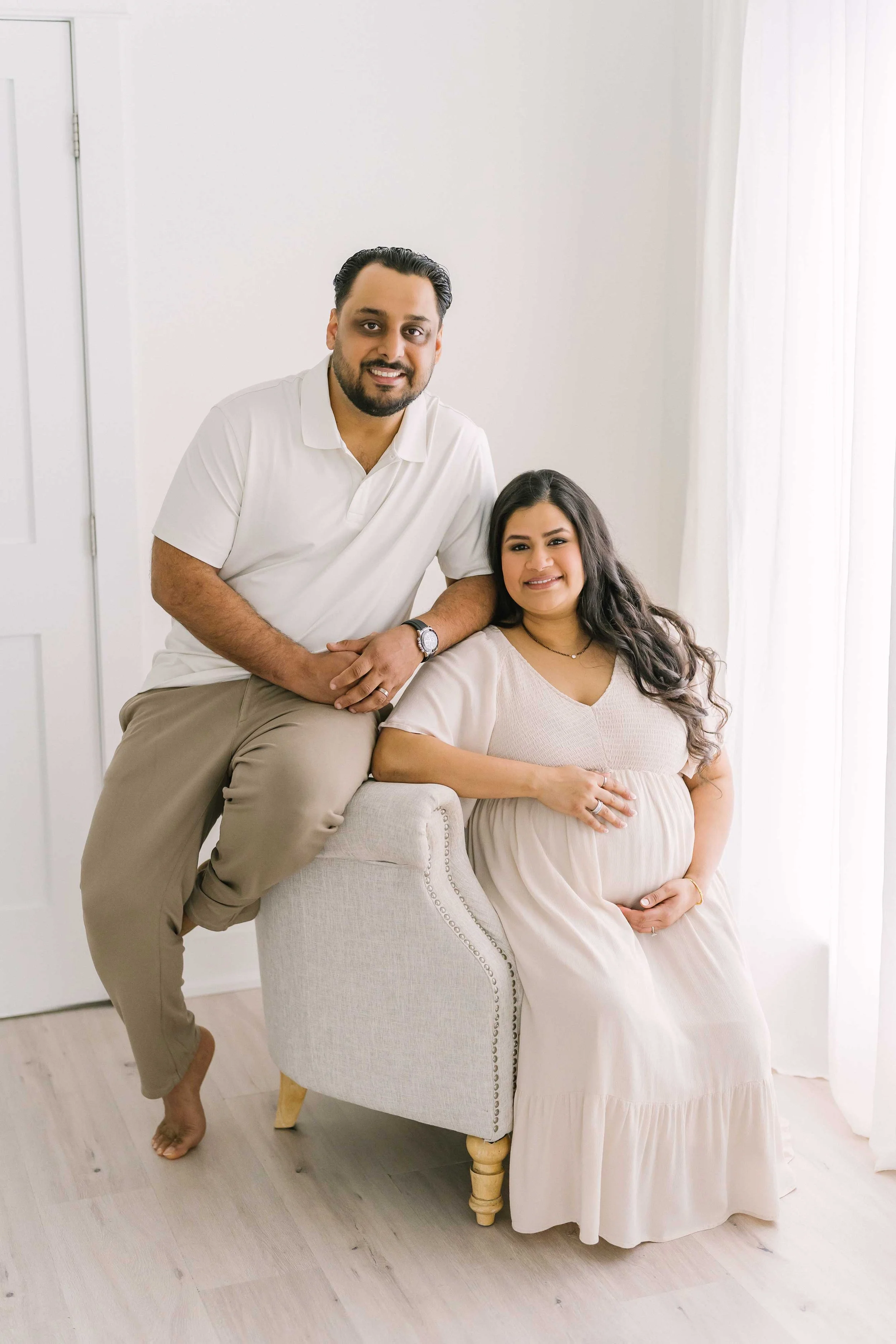 Elegant maternity studio portrait showcasing the beauty, strength, and confidence of pregnancy before the arrival of a newborn baby.