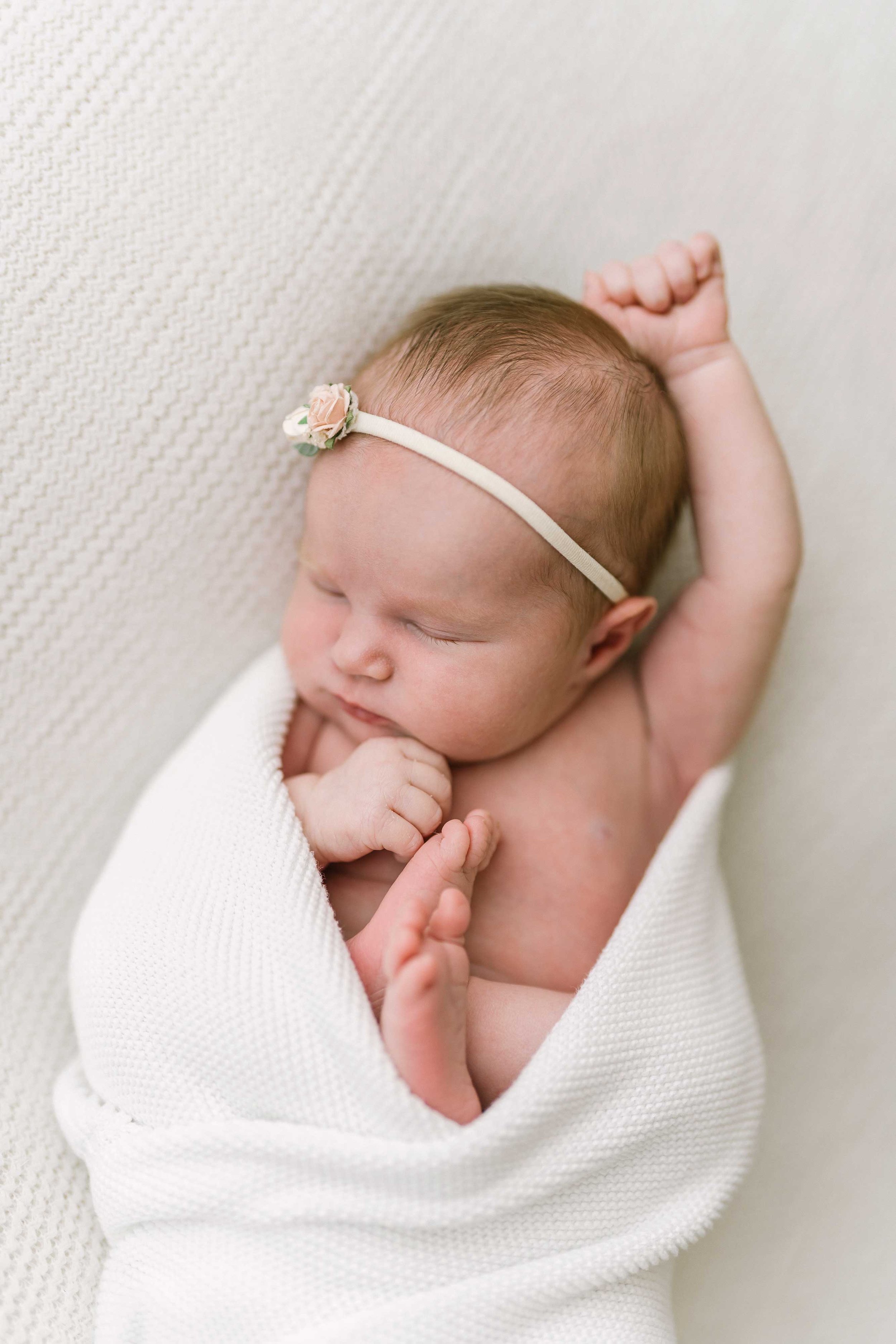 Close-up of newborn baby's delicate eyelashes, lips, and soft skin in Grimsby