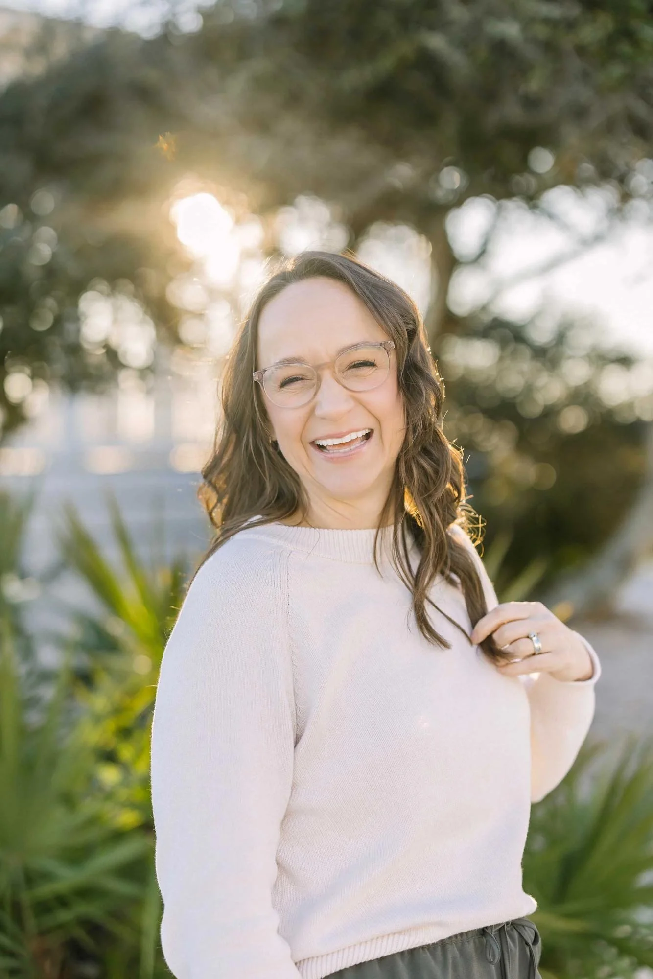 Karen Byker, Niagara newborn photographer smiling during golden hour