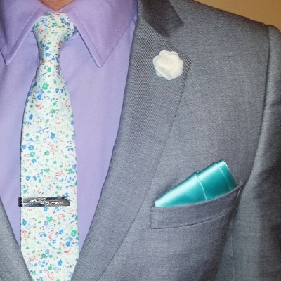 This teal pocket square in a three-stair fold complements my floral tie without being overly matchy