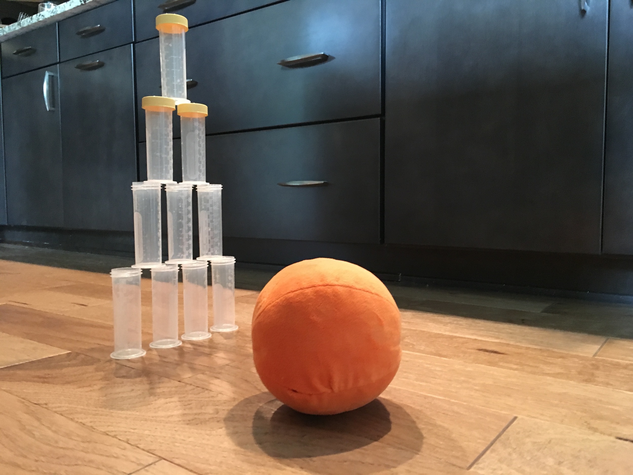 Milk storage bottles turned bowling pins.