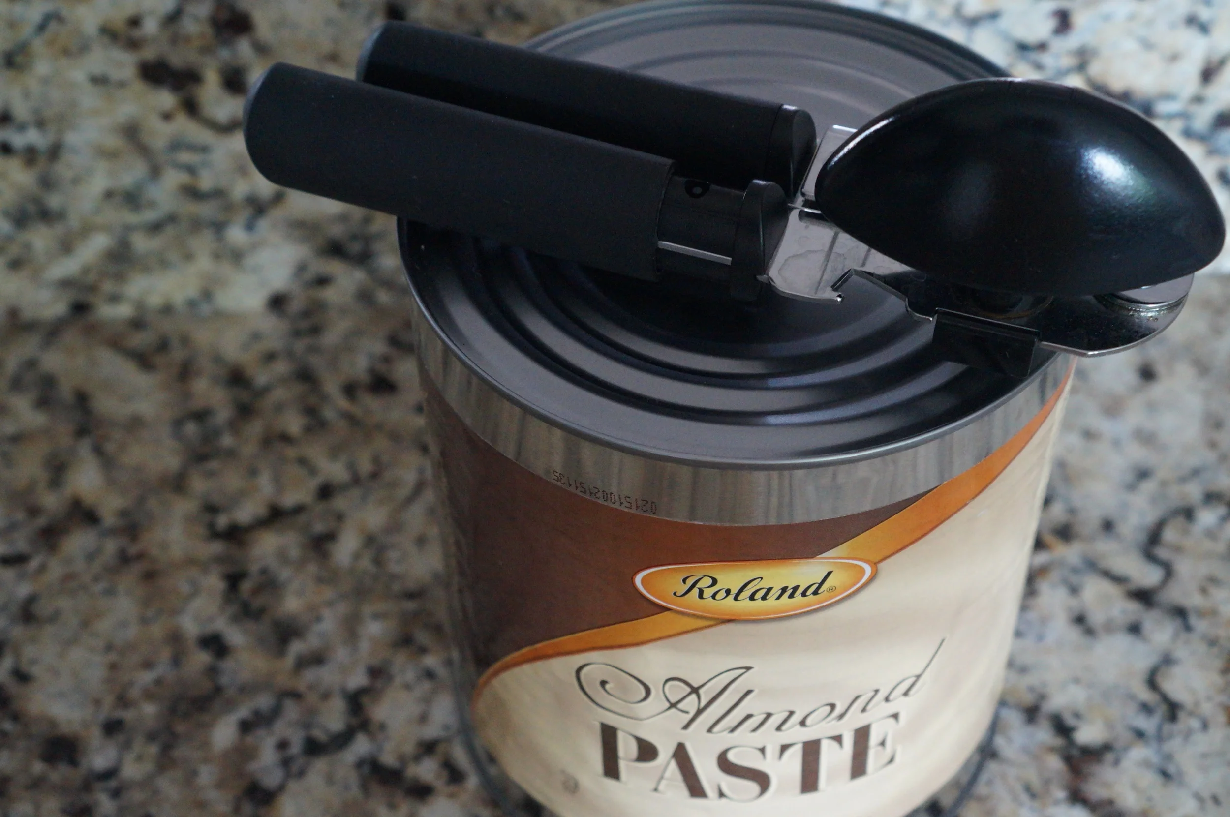 Enormous can of almond paste. Regular-sized can opener for scale.
