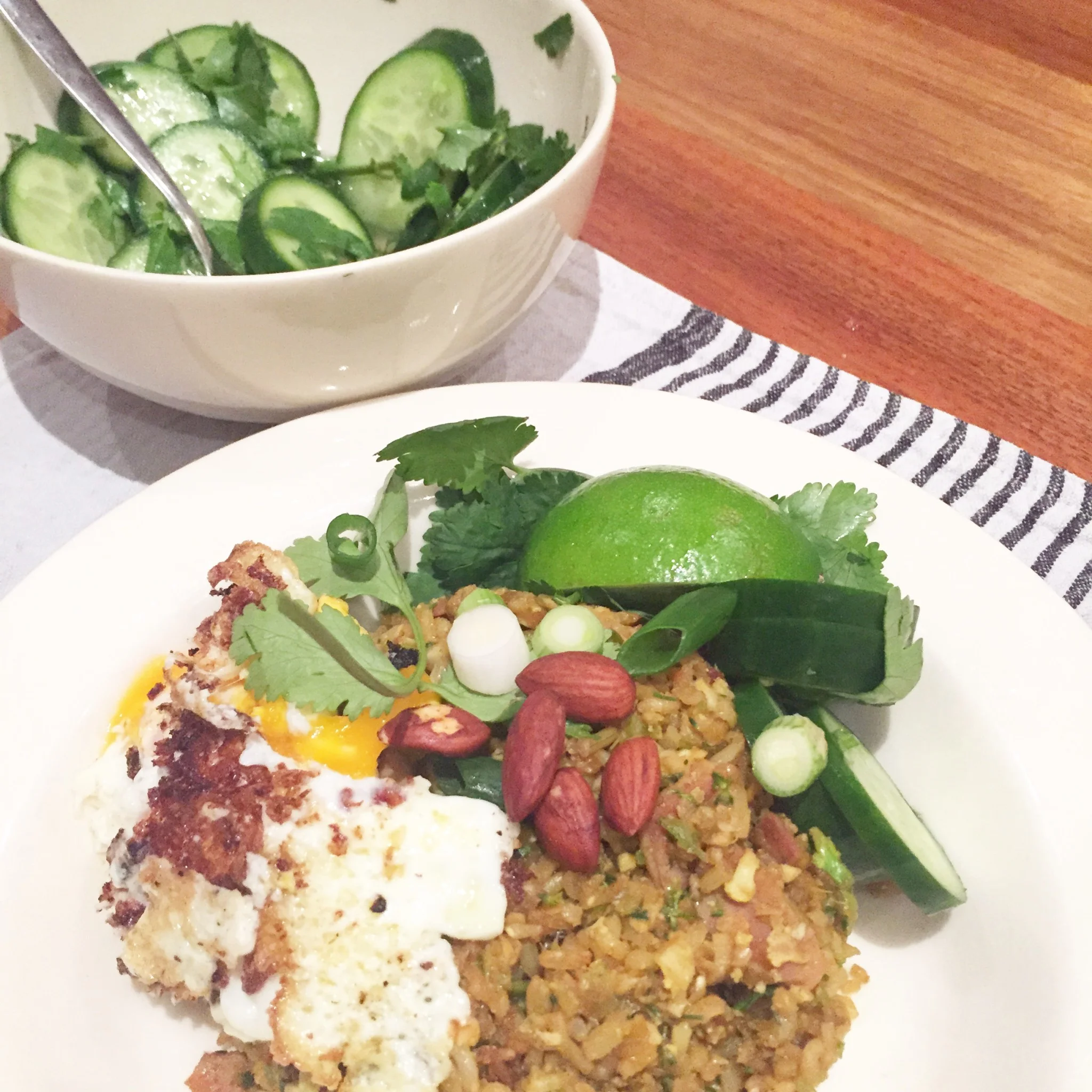 Cauliflower and broccolini fried rice served with pickled cucumber