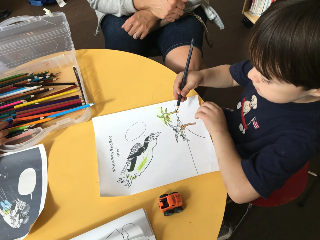 Child coloring in my Fritzy Bang Bang Color and Write Story