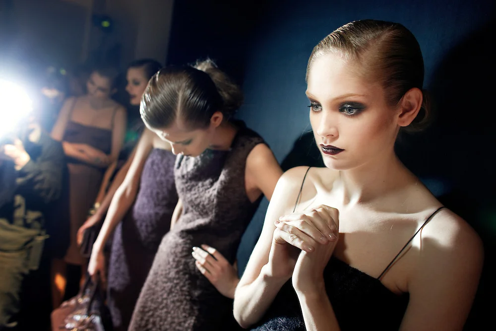 A model waits backstage at Bottega Veneta at Milan Fashion Week (photo by Dave Yoder)