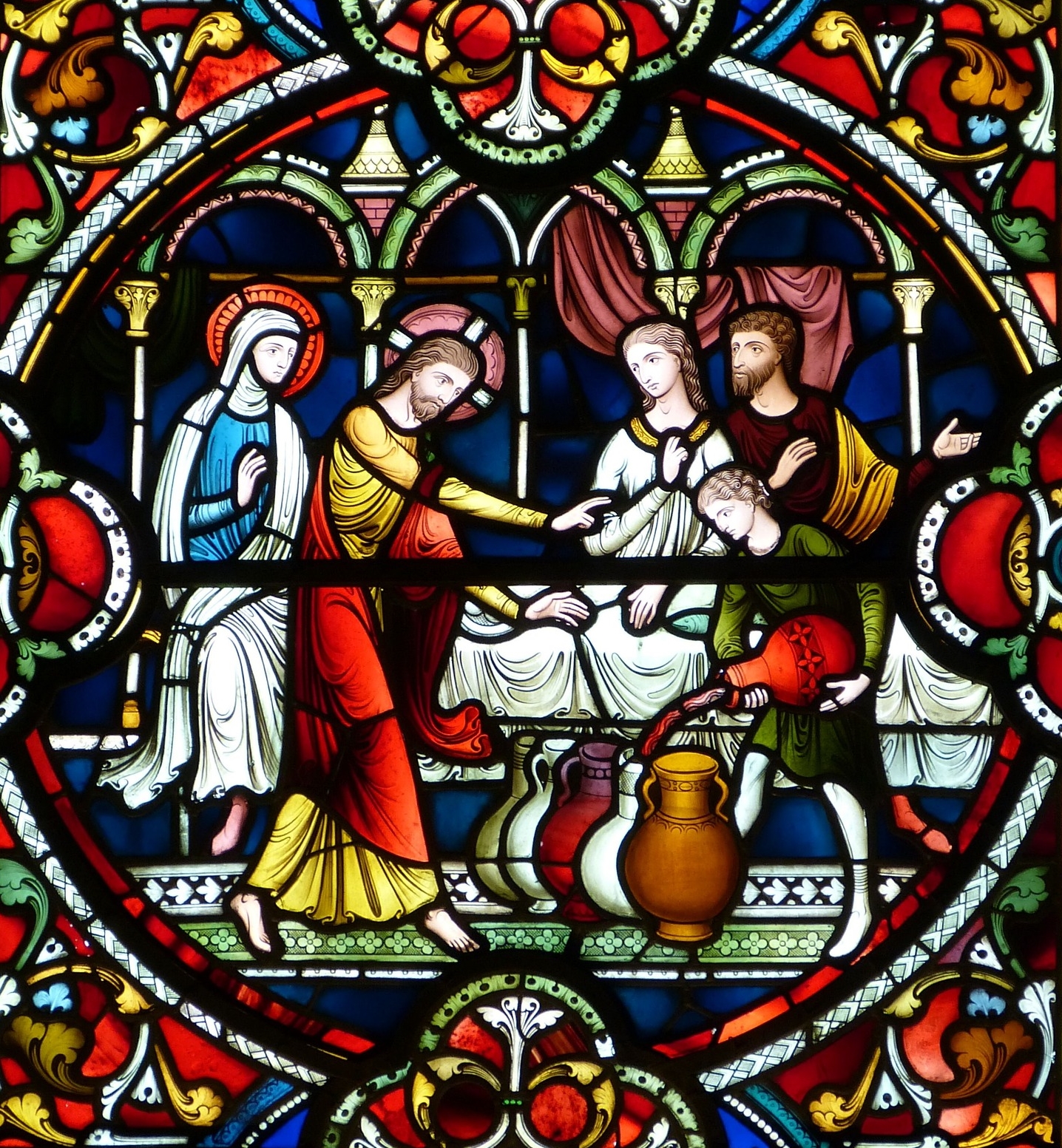 Stained glass window showing miracle at the wedding in Cana
