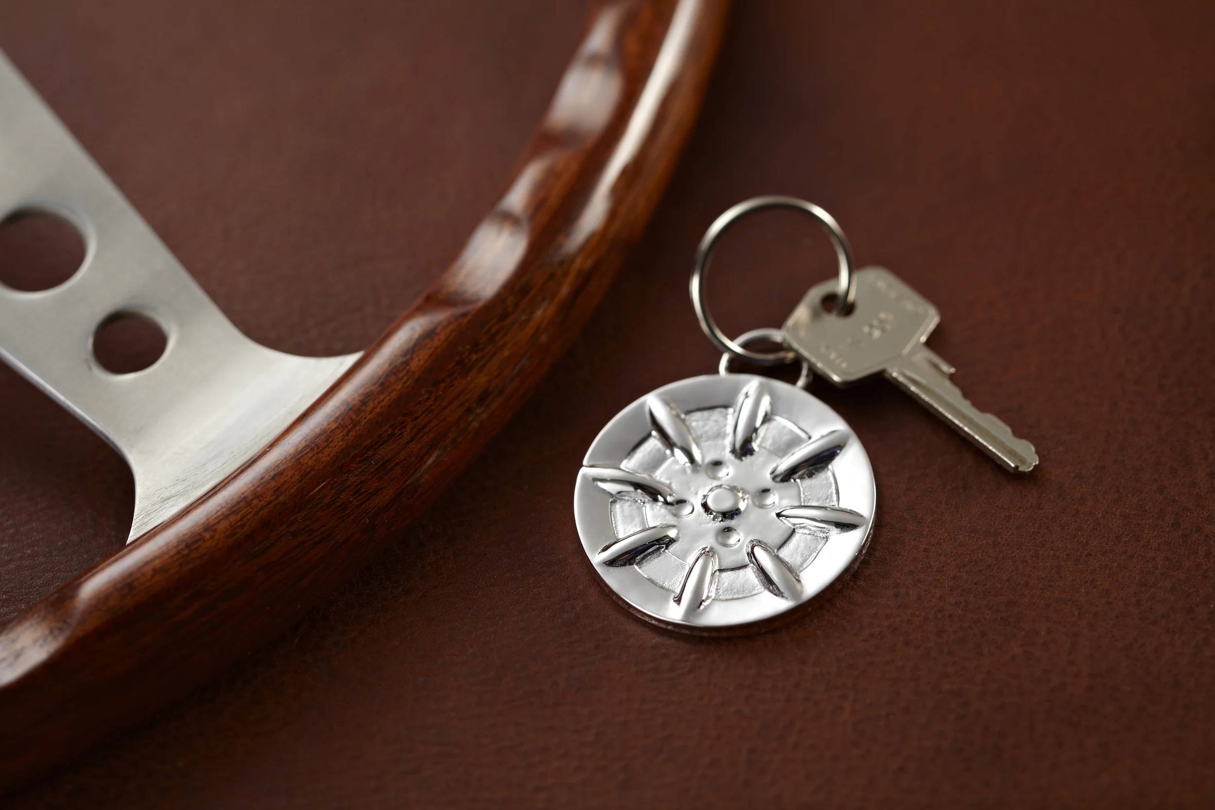 Minilite silver plated key chain front with key and wheel