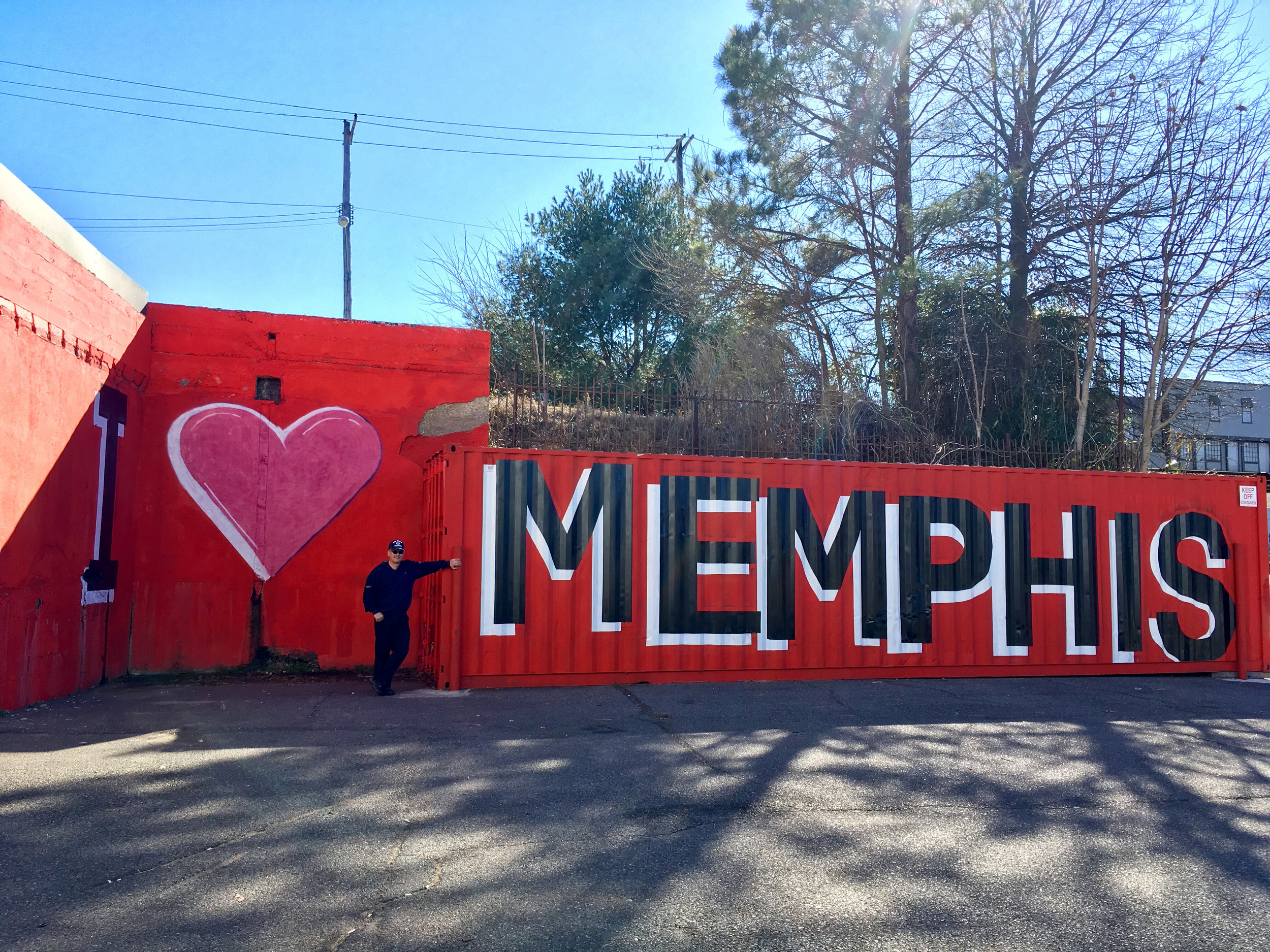 My dad by the I Love Memphis container mural.