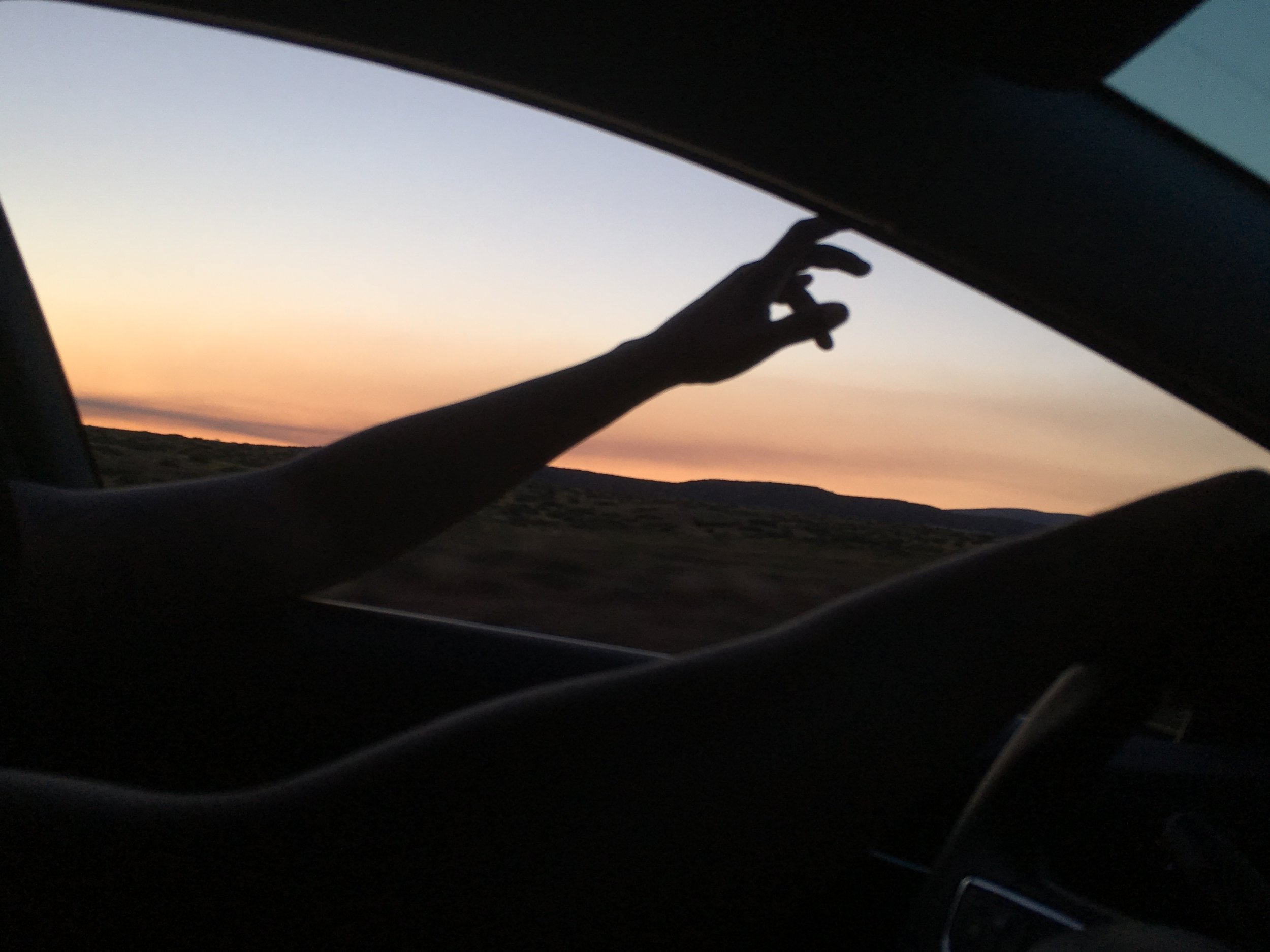 Driving through the desert at sunset. 