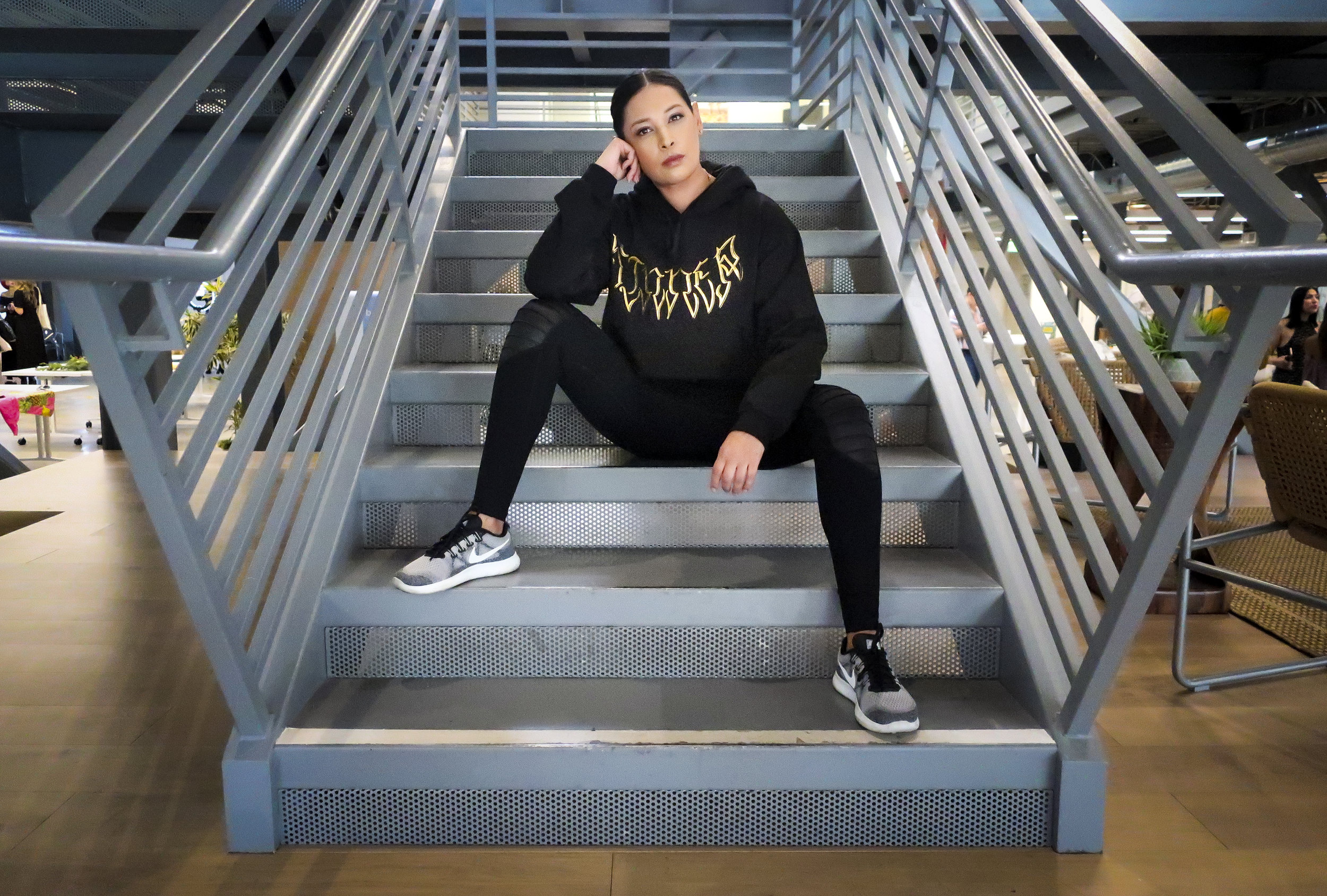 Betsy Correa wearing the SINNER Hoodie at The Spark Summit
