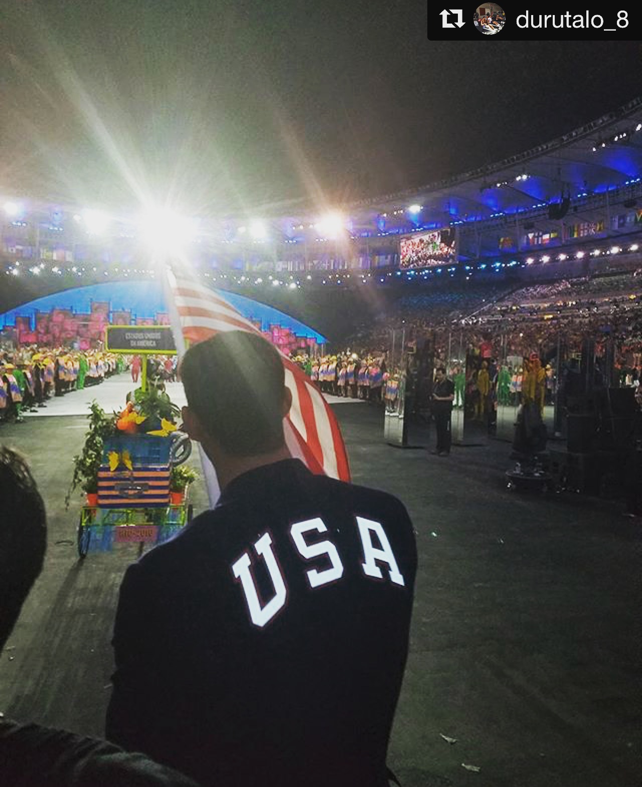 Men's Eagle Andrew Durutalo walking beside Michael Phelps, USA flag bearer, during the Olympic opening ceremonies